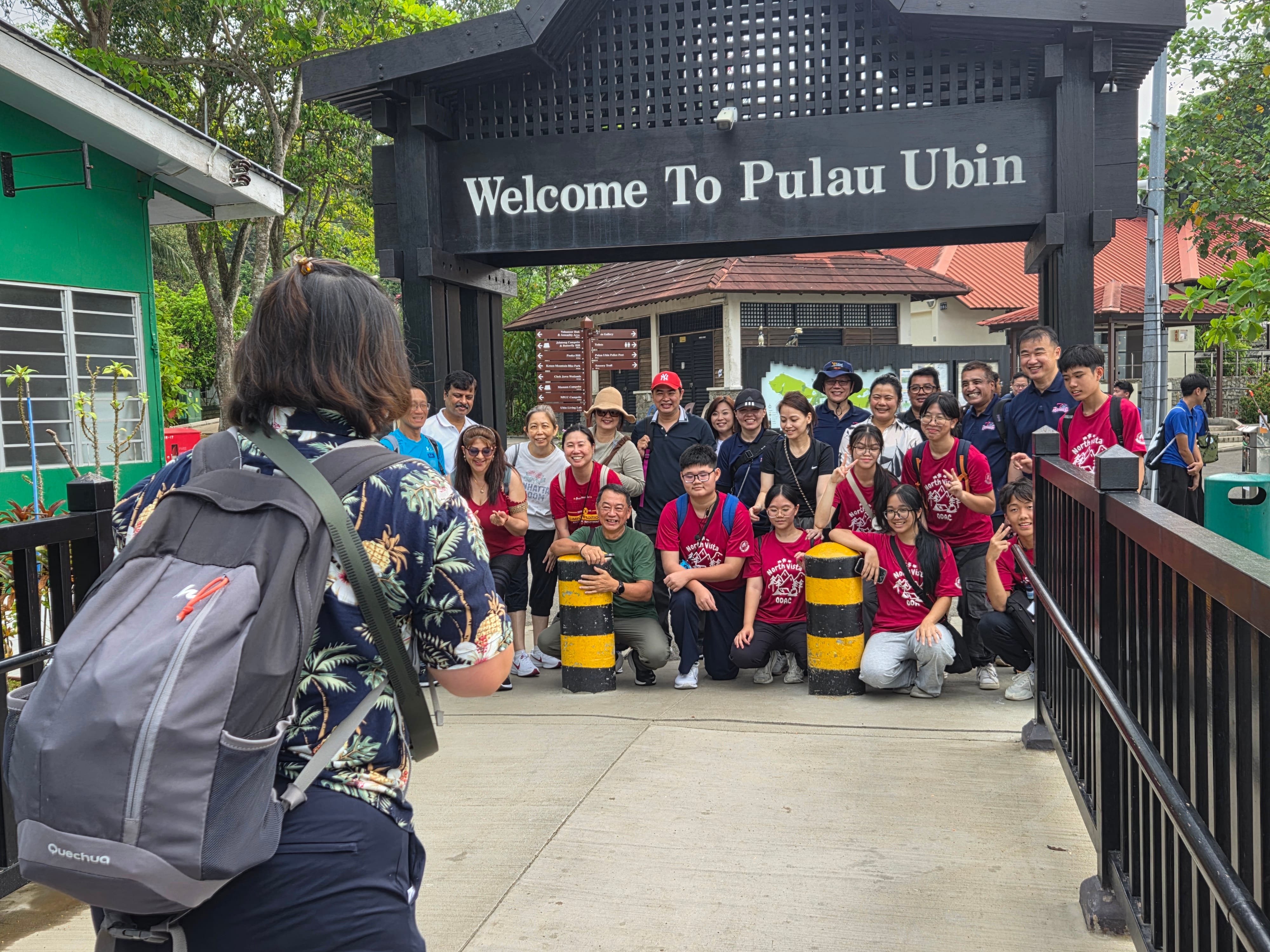 NV staff and students posing for a photo at the Pulau Ubin entrance