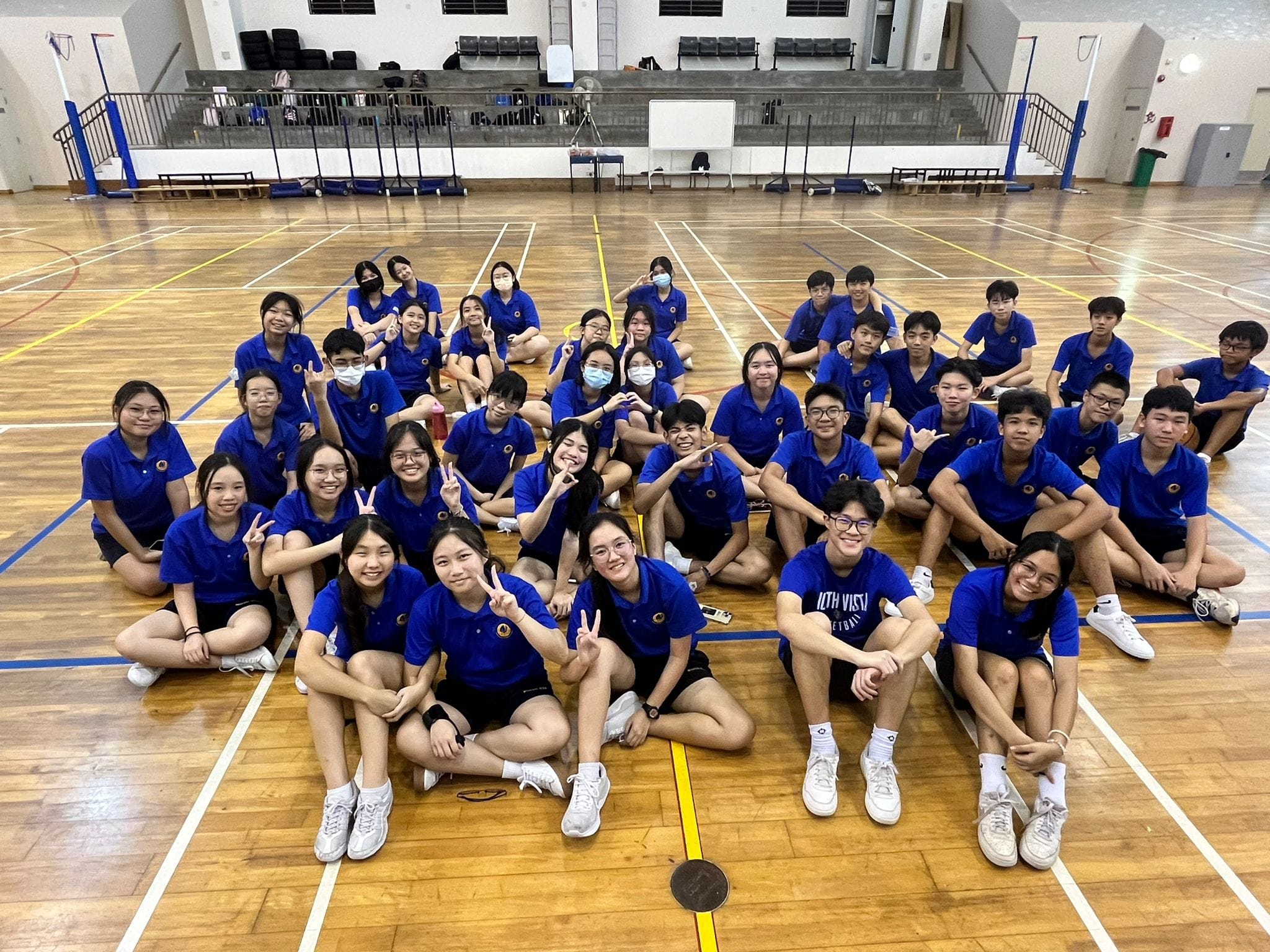 NV CCA leaders posing for a photo together in the indoor sports hall