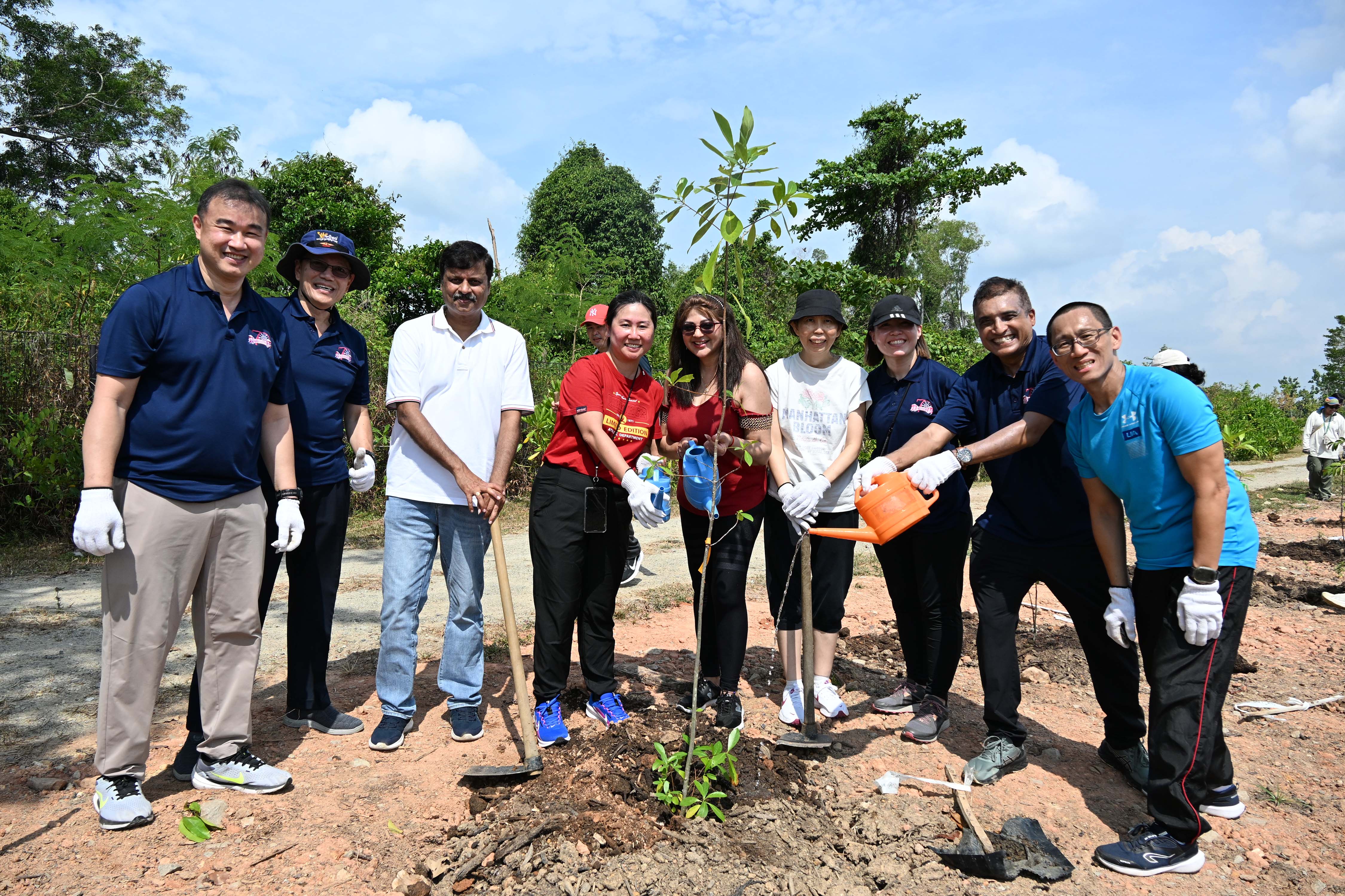 NV school leaders and staff posing for a photo after planting a tree