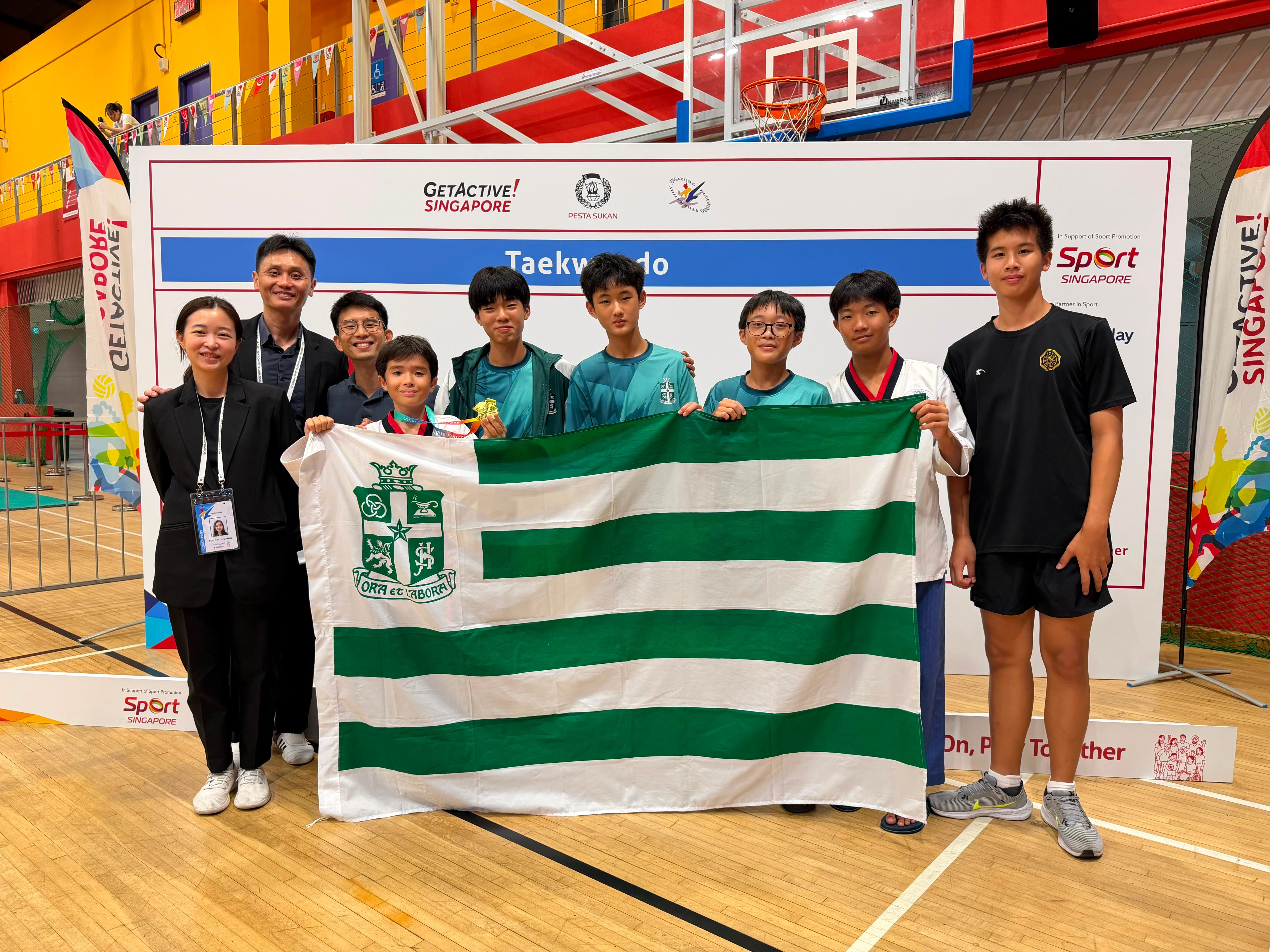 TKS holding the SJI flag