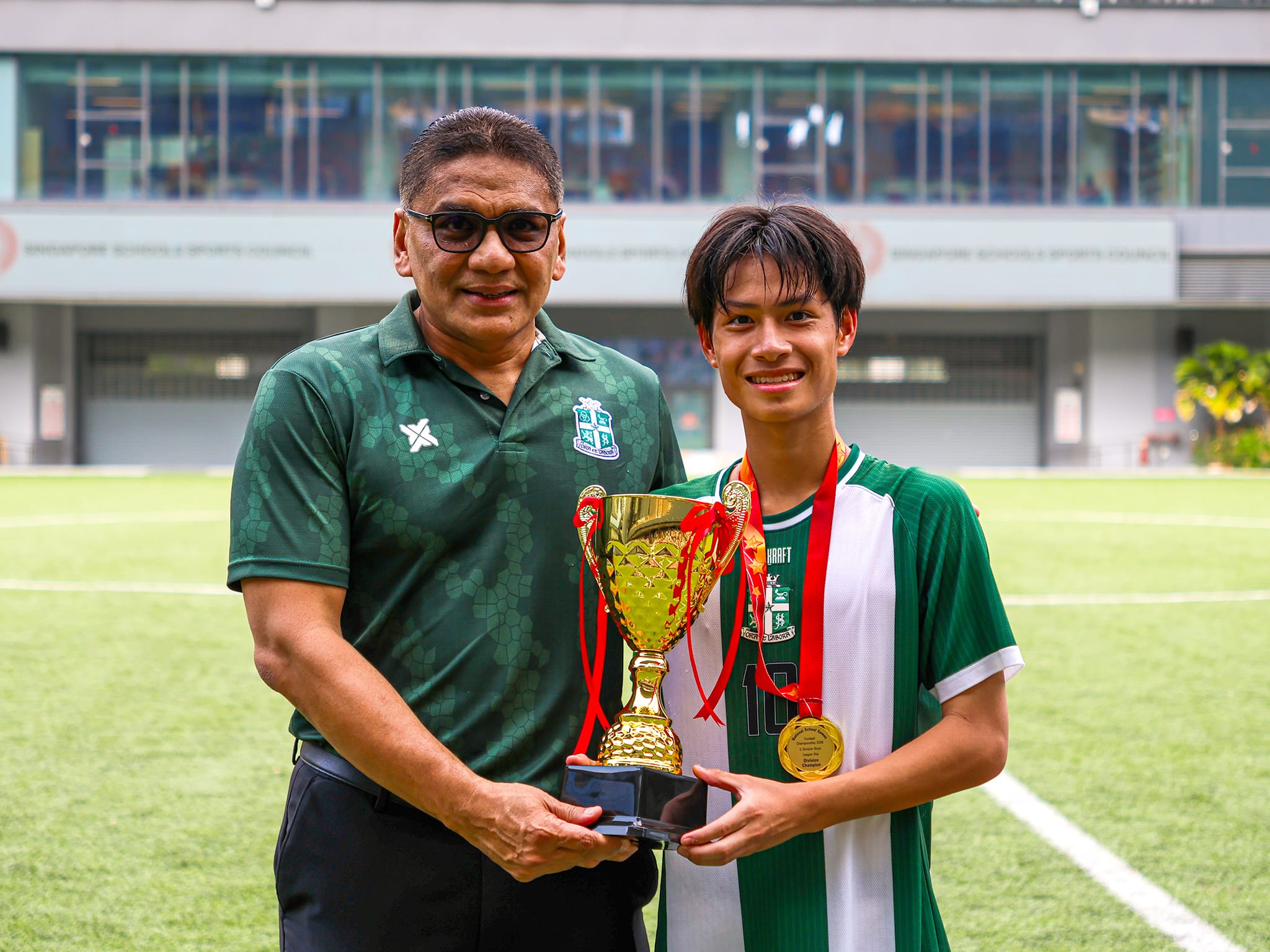 Principal with C Div Captain and trophy