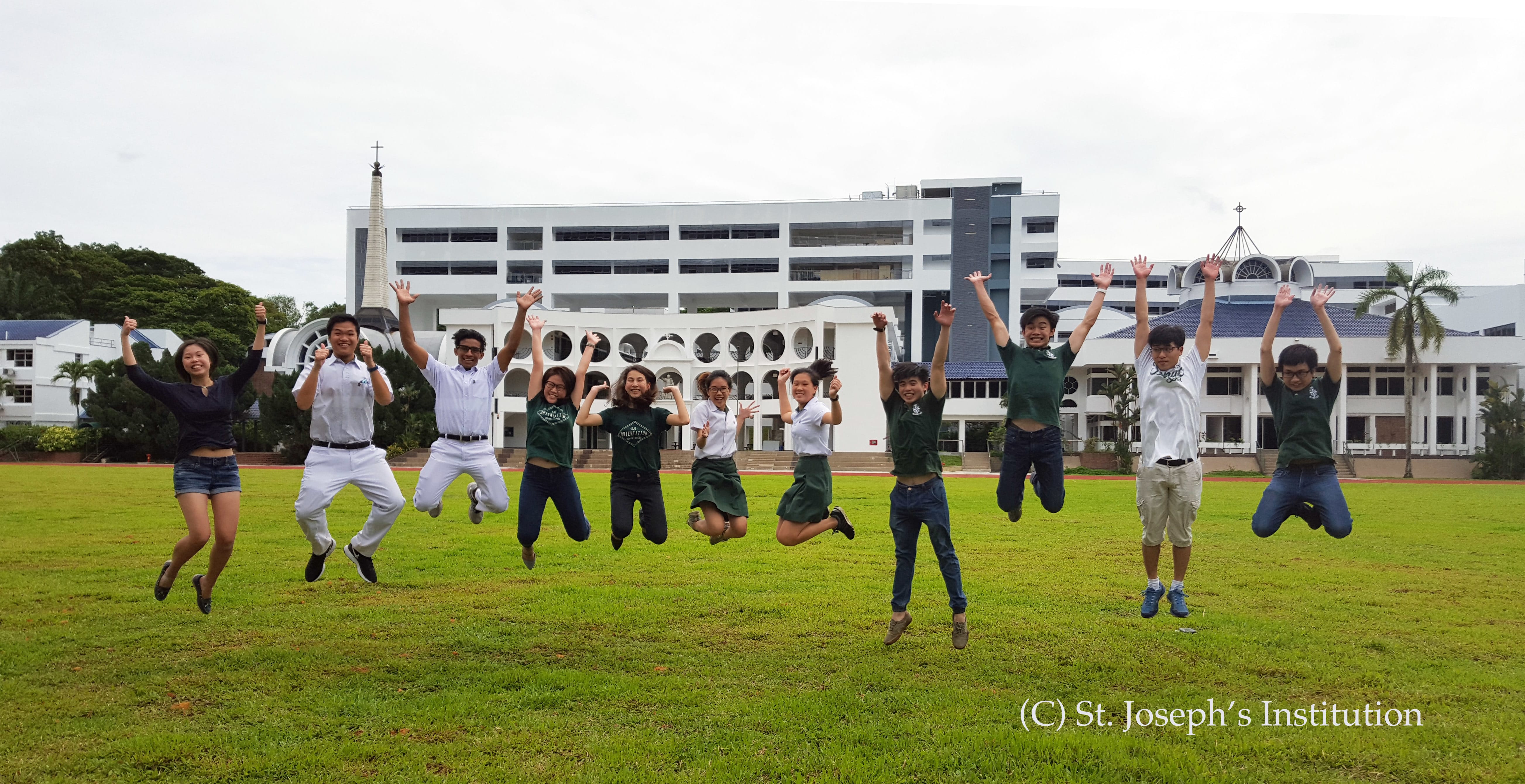 Josephians jumping joyfully in the school field