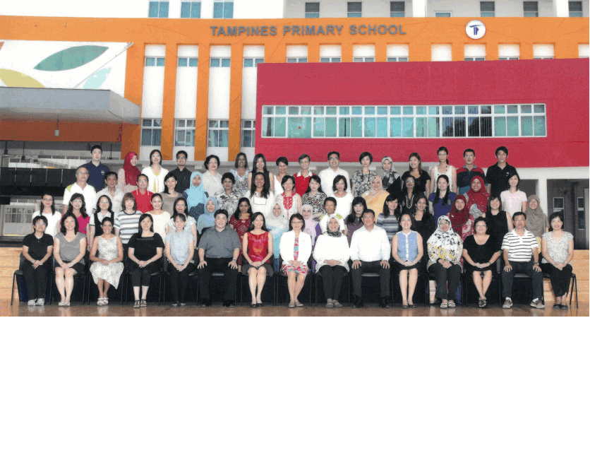 Group photo of staff posing in front of Tampines Primary School's orange and red building.