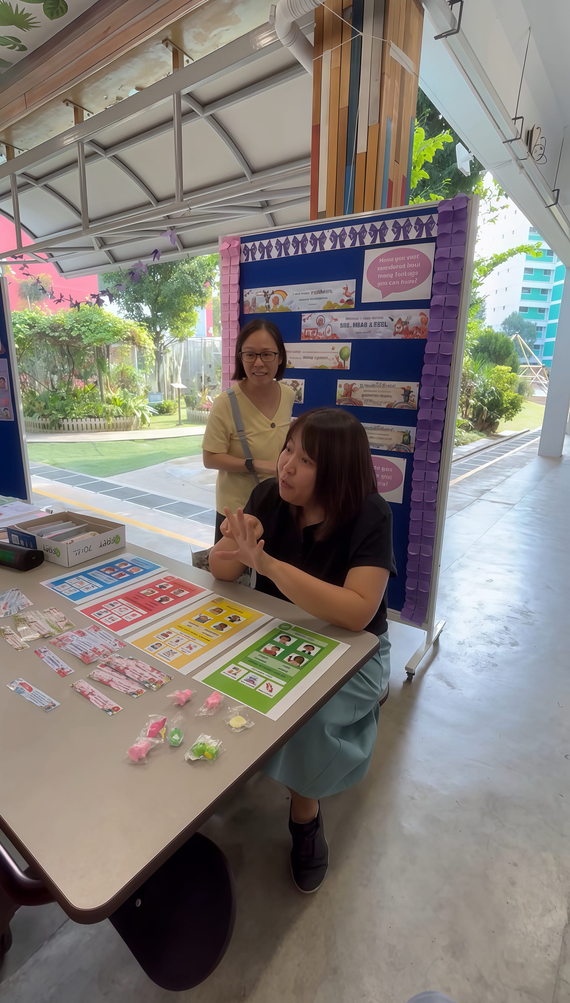 Two teachers attending to student at one of the awareness booth.