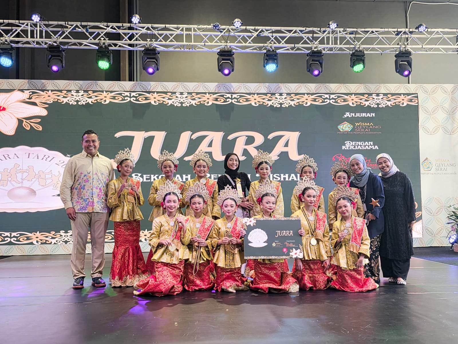 Our dancers proudly posed with their teacher-in-charge, celebrating their achievement and the shared dedication behind their success.