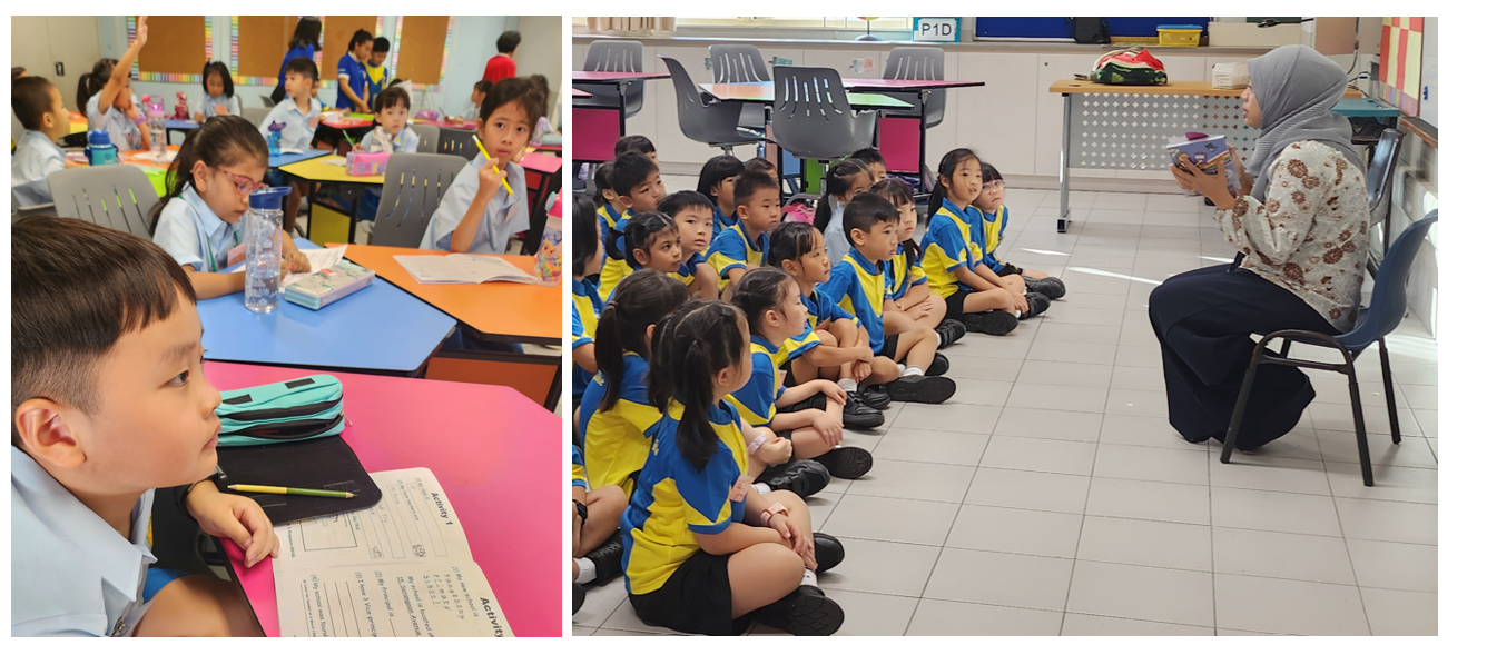 Young students in blue uniforms sit on a floor listening to a teacher reading a book, while others work at colorful desks.
