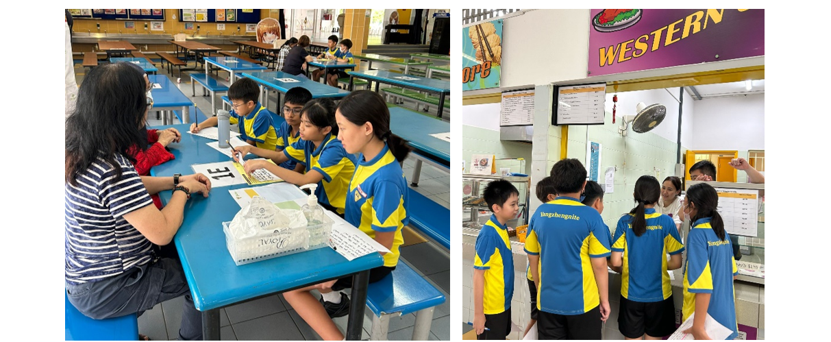 Students in blue and yellow uniforms sit at cafeteria tables with an adult, and others stand at a Western food stall.