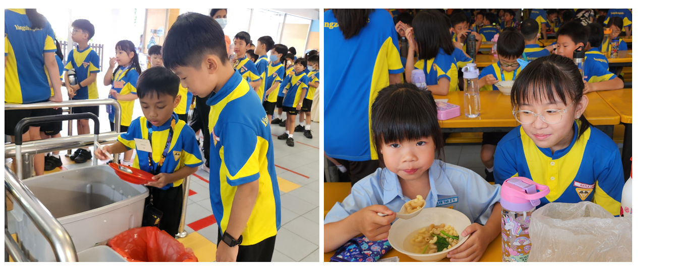 Children in blue and yellow uniforms eat lunch and return trays at a school cafeteria.
