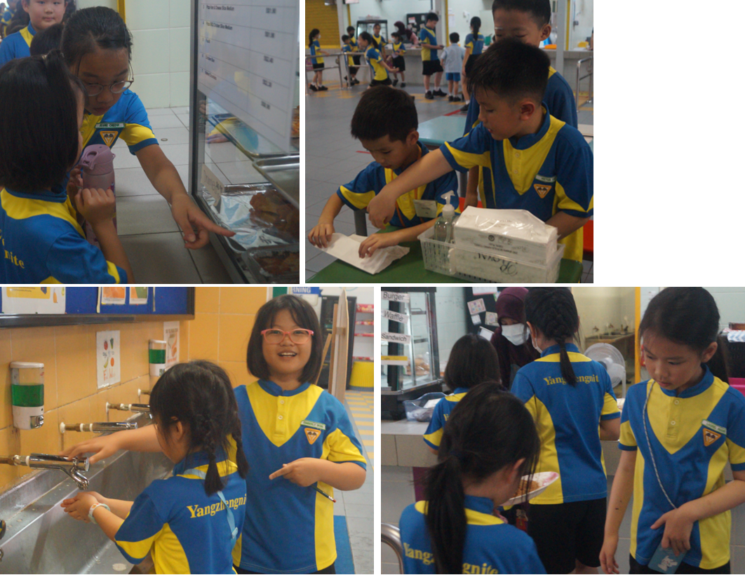 Children in blue and yellow school uniforms at a canteen, washing hands, handling items, and exploring food stalls.