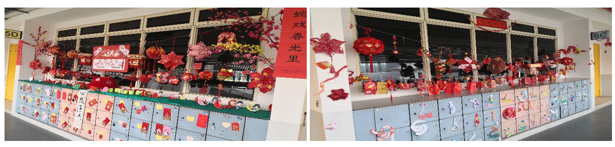 School corridor with lockers decorated in red Chinese New Year ornaments, lanterns, paper cutouts, and banners.
