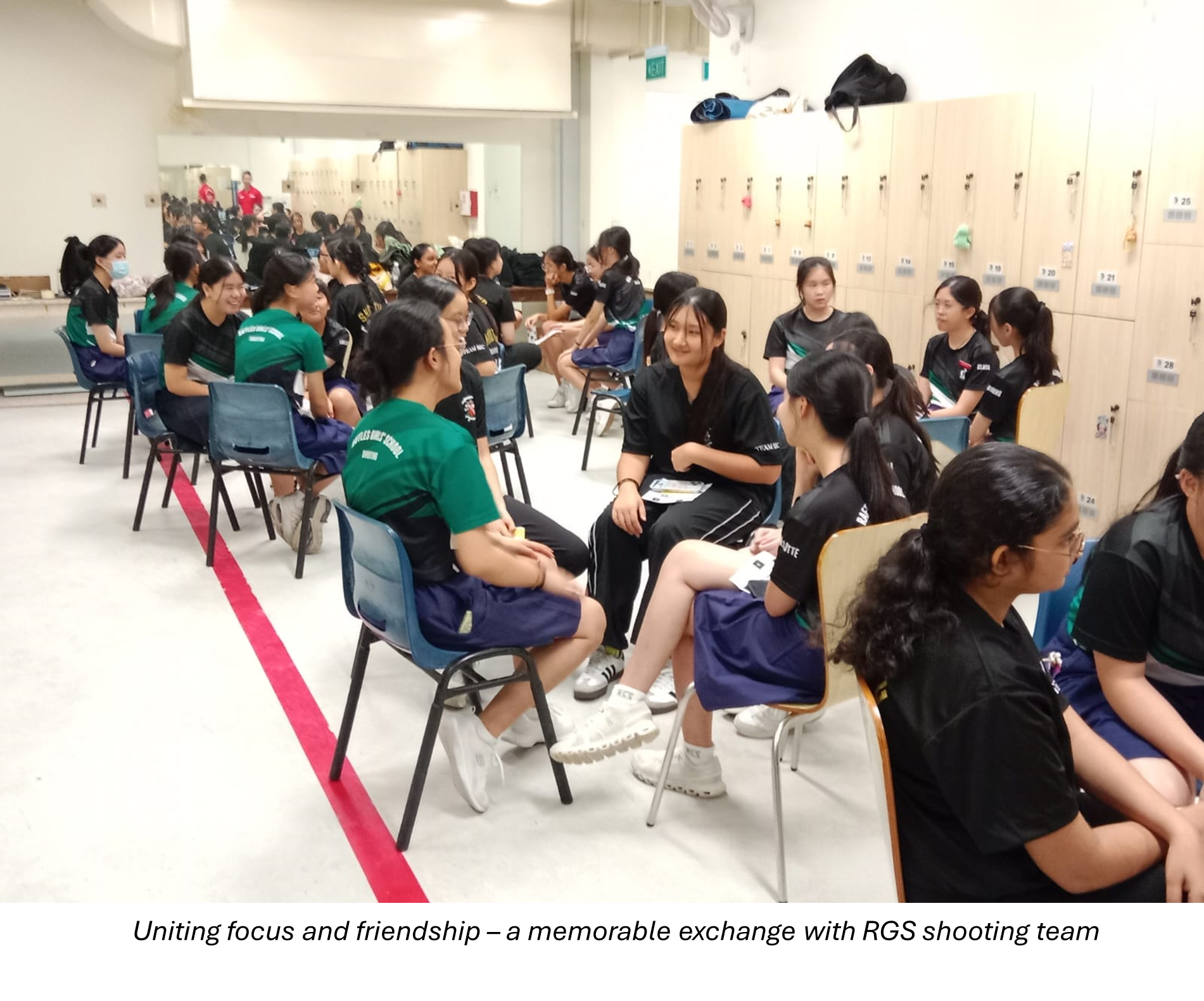 Students sitting on chairs exchanging conversations with RGS students