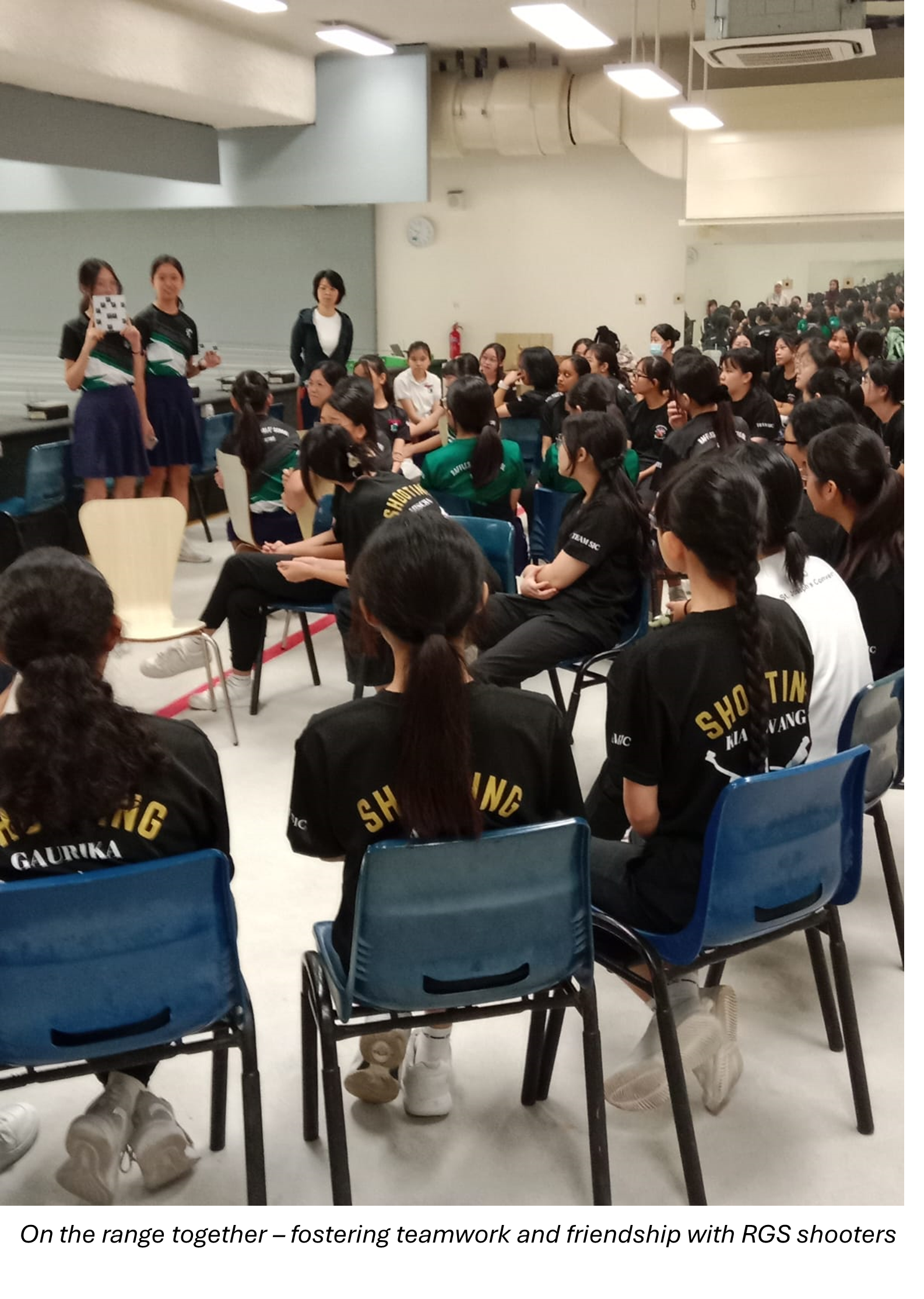 Groups of students sitting down and listening to presentation