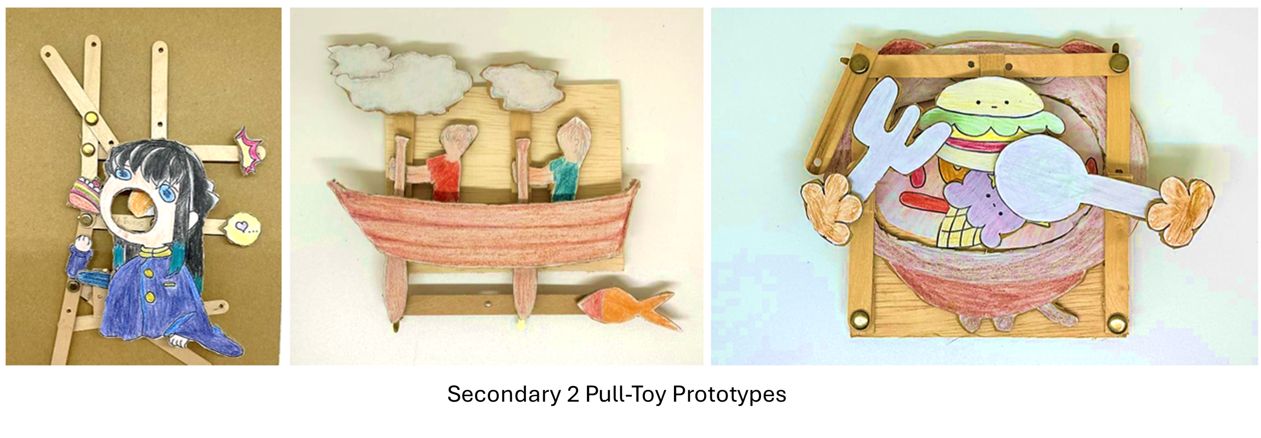 Three student-made pull-toy prototypes with wooden frames and hand-drawn colored paper figures attached.
