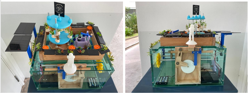 Two views of a small aquaponics model with a glass tank, wooden platform, solar panels, plants, and colorful 3D-printed parts.
