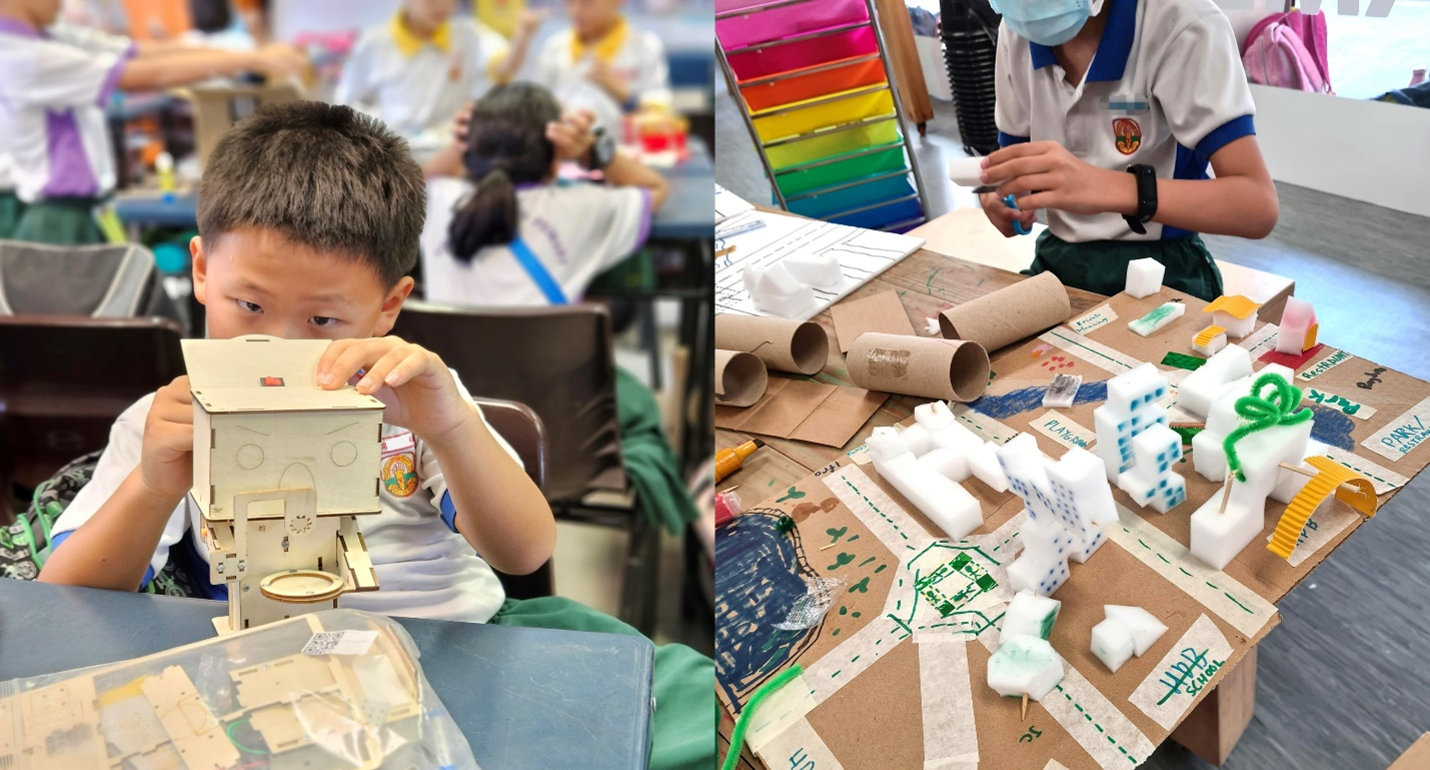 Two students doing hands-on projects: one assembles a wooden model house, another builds a cardboard city with foam blocks.