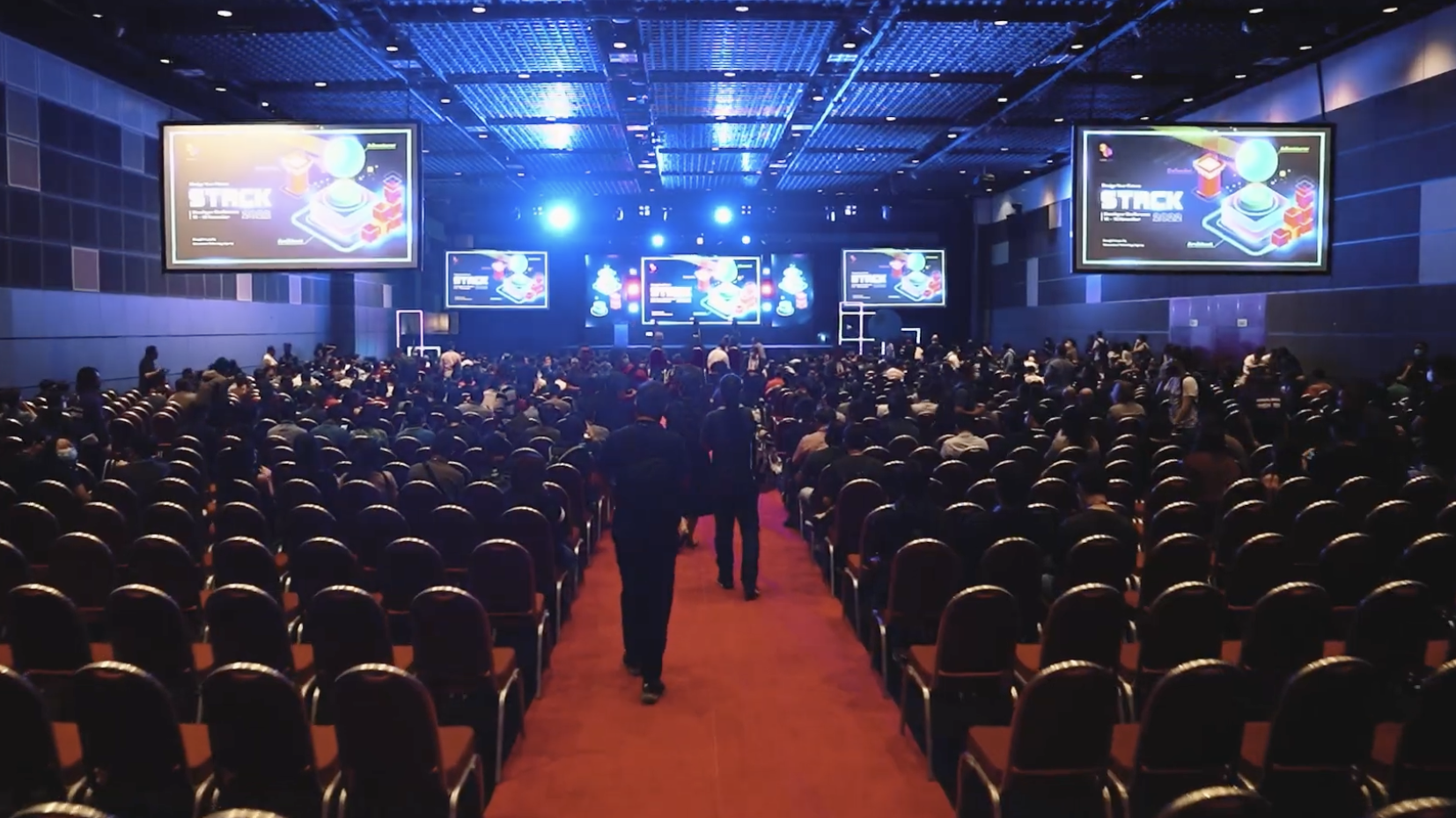 Image shows the STACK Developer Conference taking place in a hybrid setting