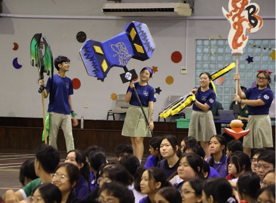 Student Councillors holding up their hand-crafted House weapons.