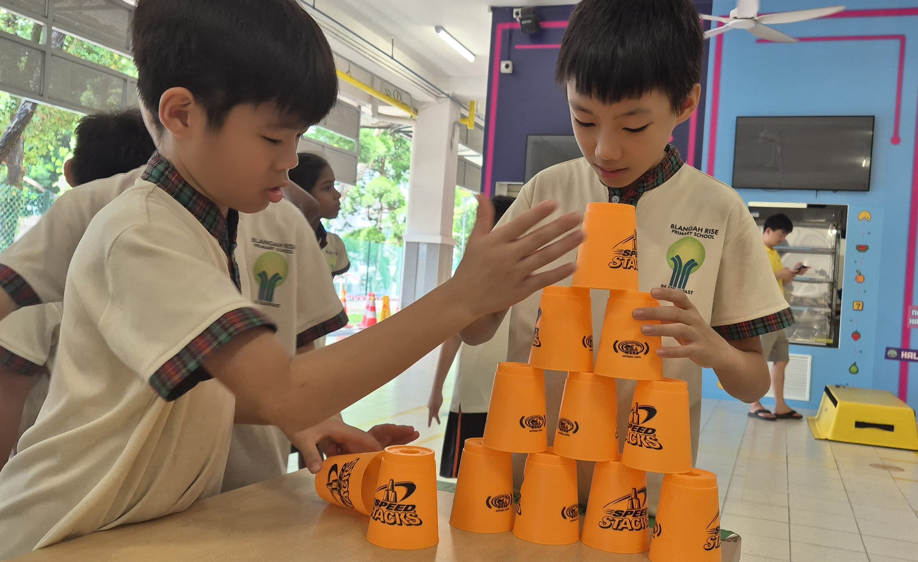 Student stacking cups