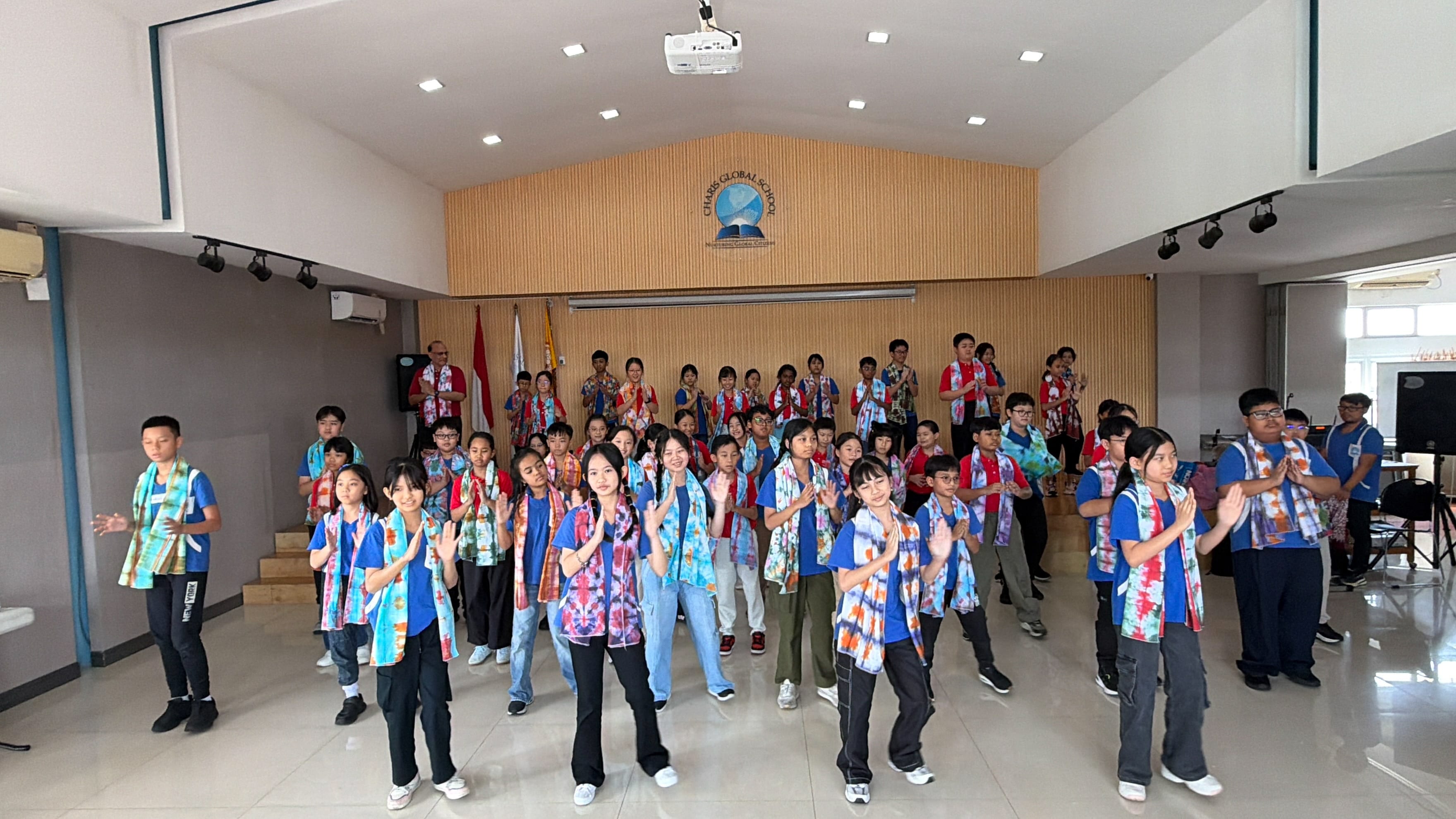 Canberra Primary School and Charis Global School students performing together during a cross-cultural activity.