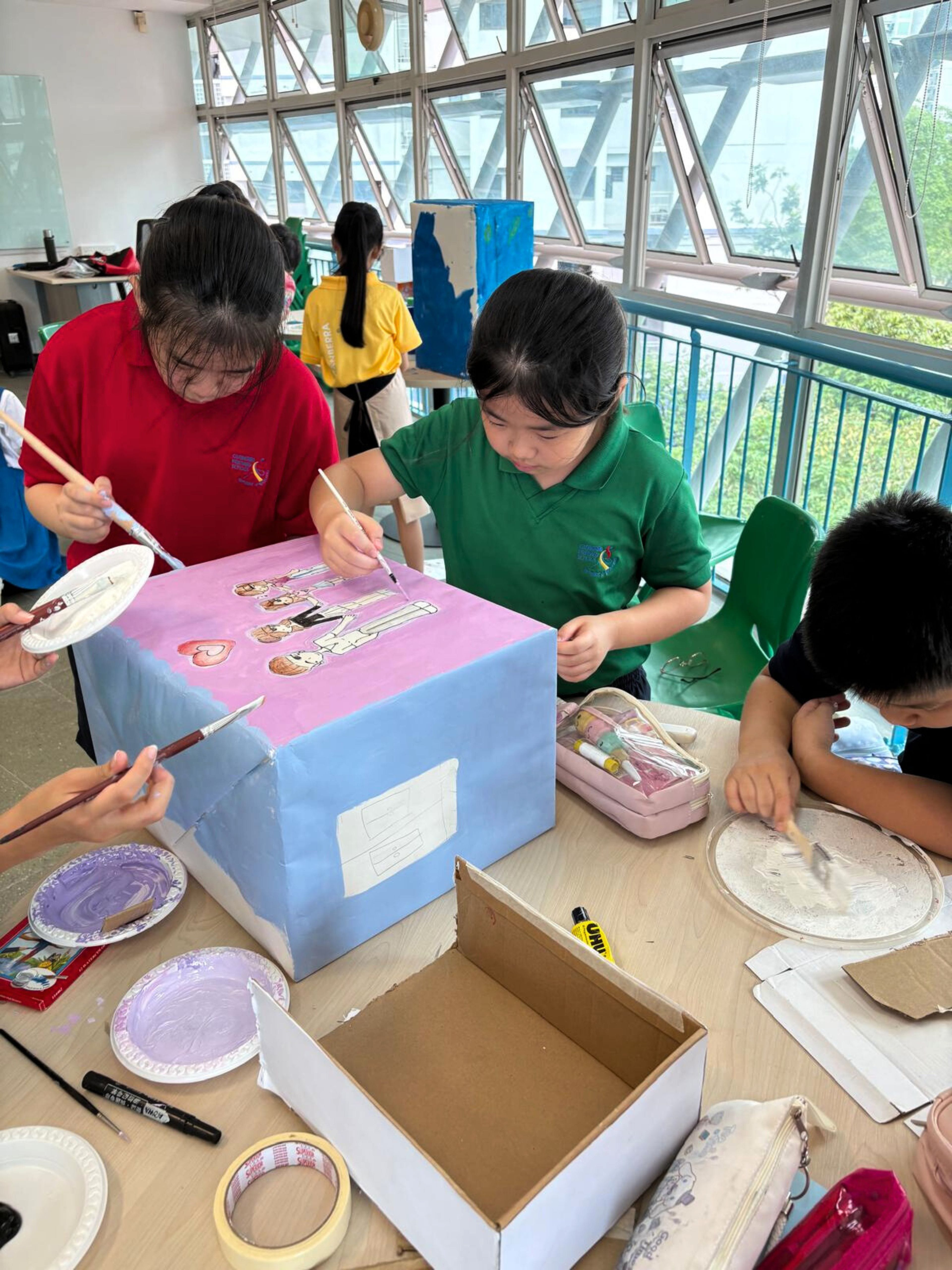 Painting on paper? Too mainstream. Let’s paint on a box!