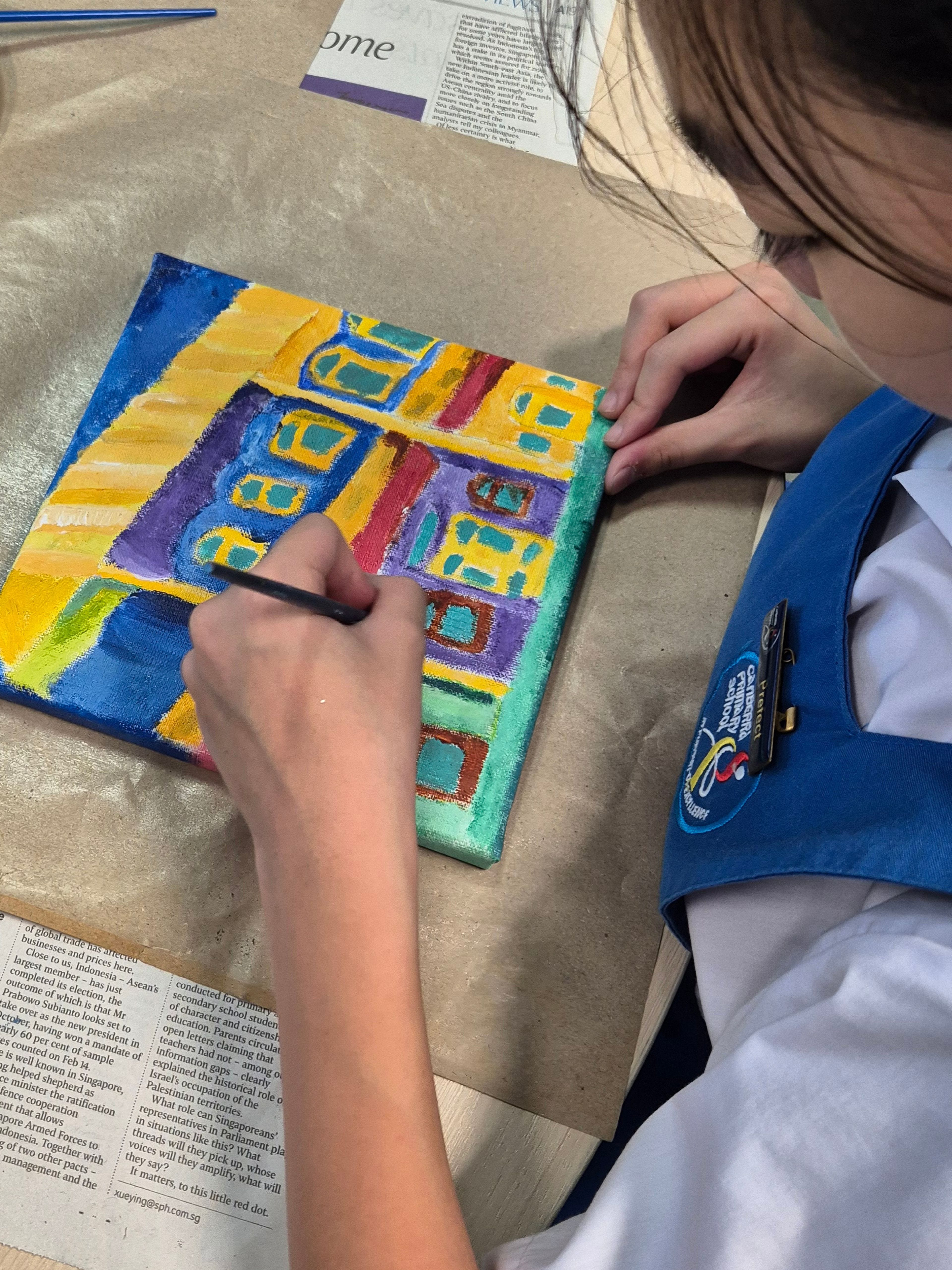 Student doing paint work.
