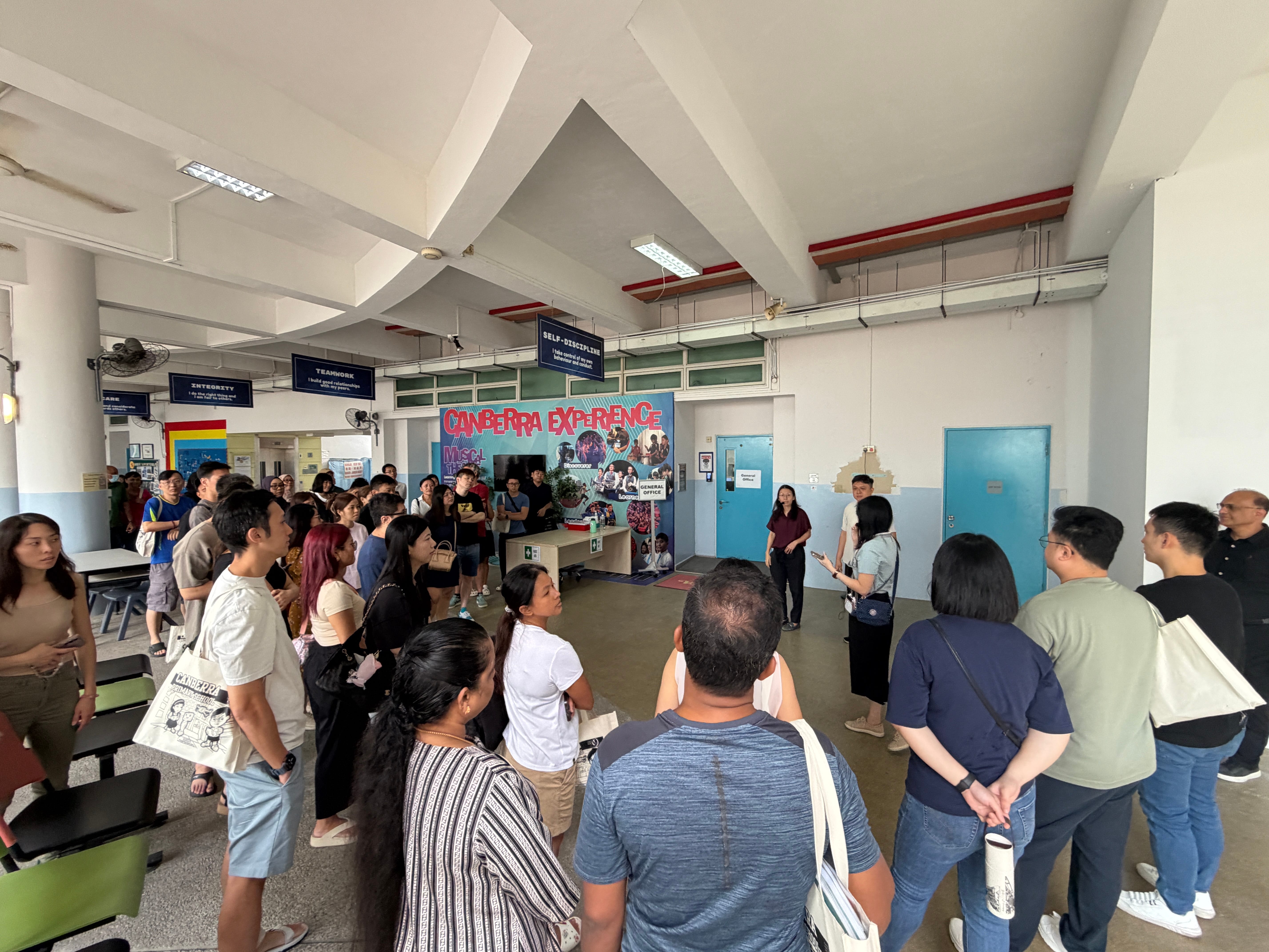 Parents and caregivers gather at the school's orientation briefing, getting acquainted with the school environment as part of the "To CPS We Go" programme. 