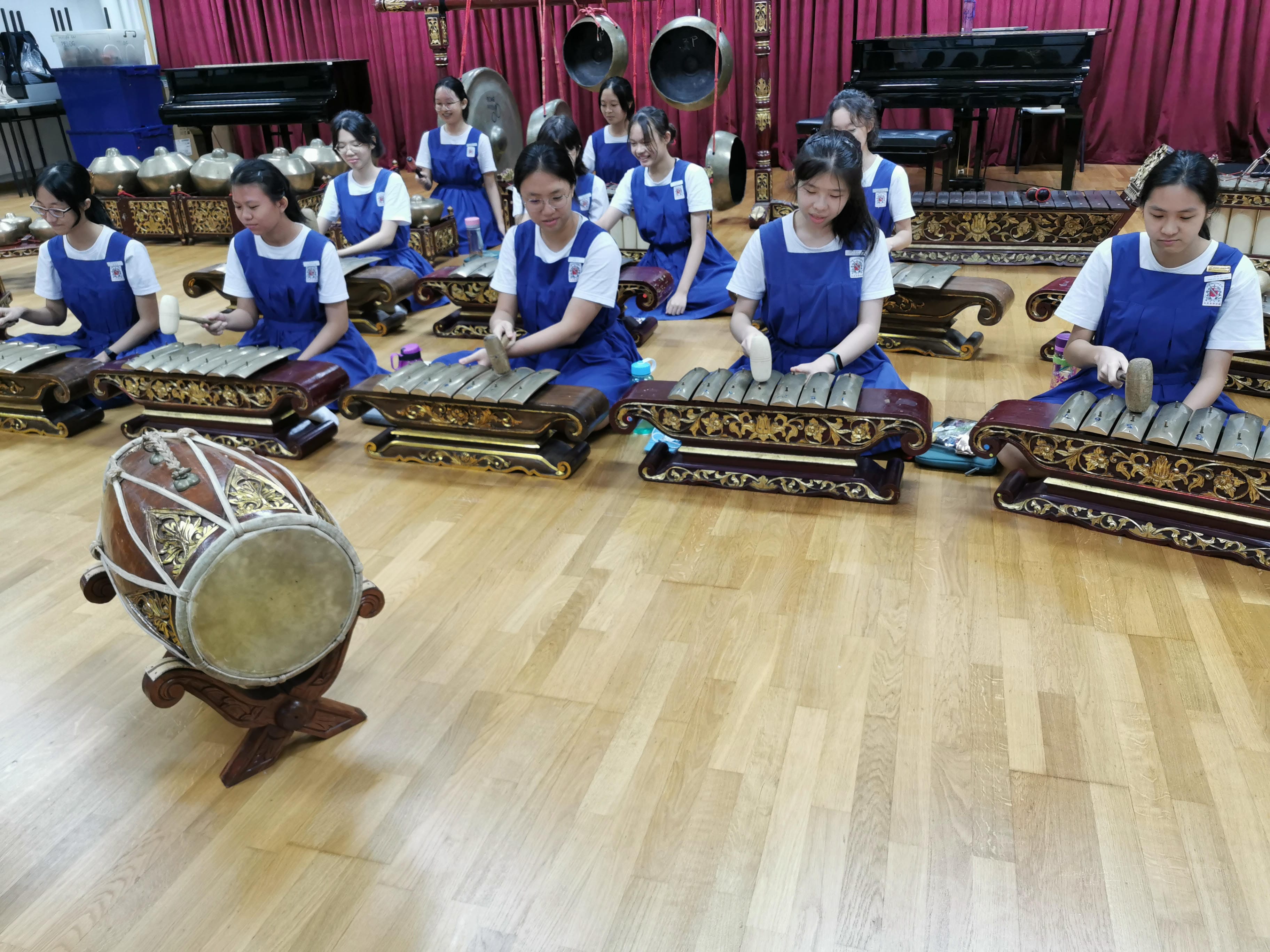 Students practicing traditional instruments during a hands-on Gamelan workshop.