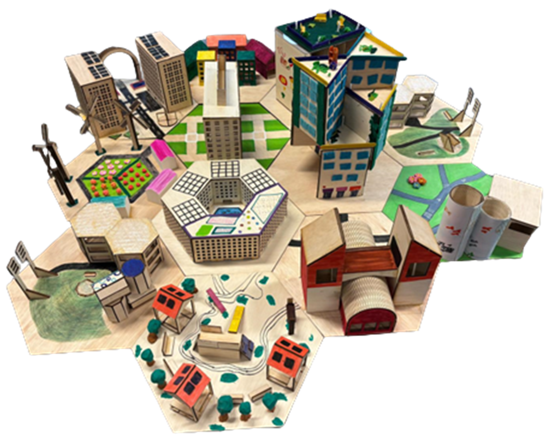 Tabletop miniature city with buildings, wind turbines, parks, and small houses on hexagonal tiles.