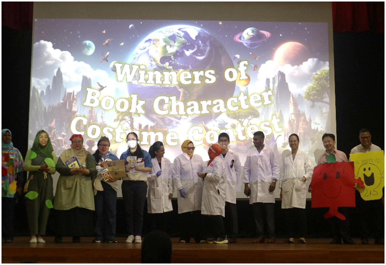Group of people in costumes standing on stage before a screen reading "Winners of Book Character Costume Contest."