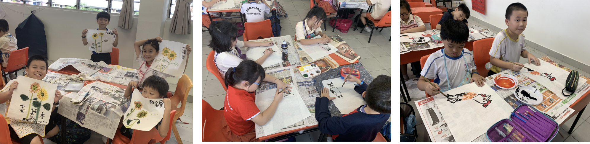 Young students in a classroom display and paint sunflower and animal artworks on large paper spread over desks.