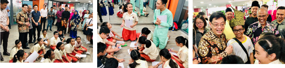 Three photos show adults in traditional attire interacting with children sitting on the floor, writing or drawing during an event.