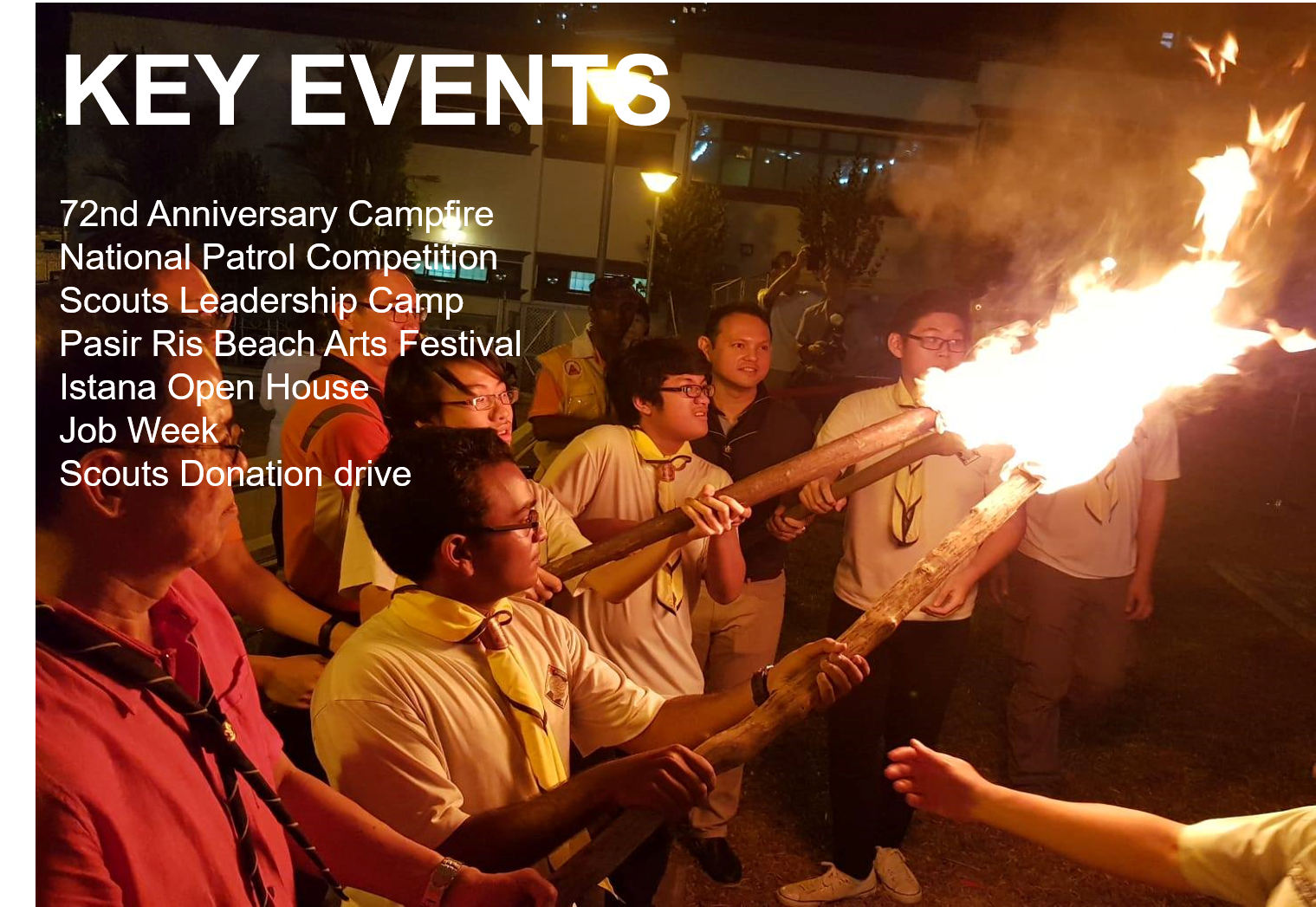 Scouts in uniform holding a flaming wooden torch at a nighttime campfire event, with key events text overlay.