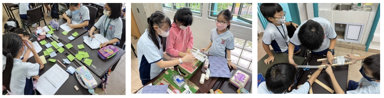 Enter a descripThree side-by-side photos showing primary school students wearing face masks and school uniforms engaged in group activities inside a classroom. In the first image on the left, four students gather around a desk covered in green sticky notes, writing in notebooks. In the middle image, three students stand together at a desk working with cardboard boxes, colored paper, and craft materials. In the third image on the right, four students collaborate at a desk to build a structure using wooden sticks, tape, and a plastic bottle.tive alt text.