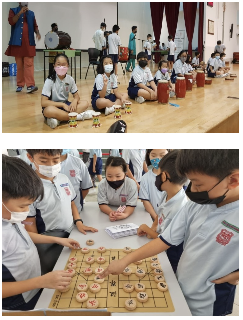 Children in school uniforms and masks sit with small drums above, and play Chinese chess below.