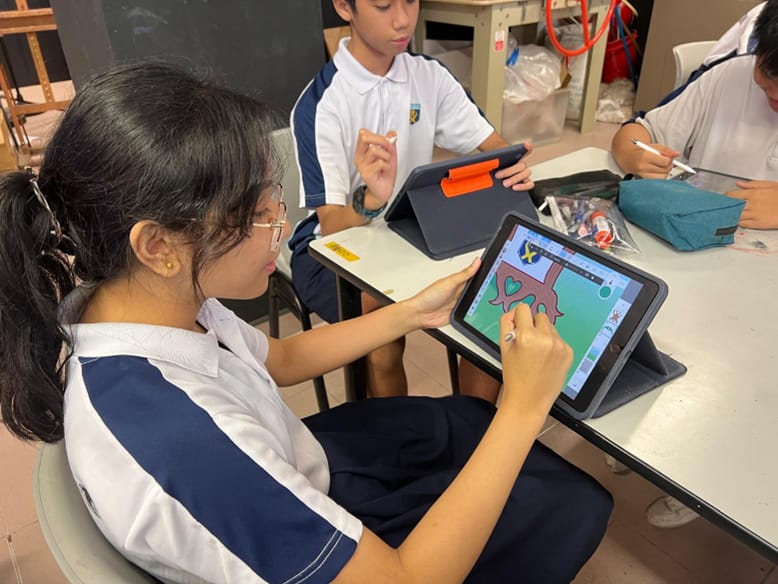 A Ngee Ann Secondary student drawing on her iPad using a stylus.