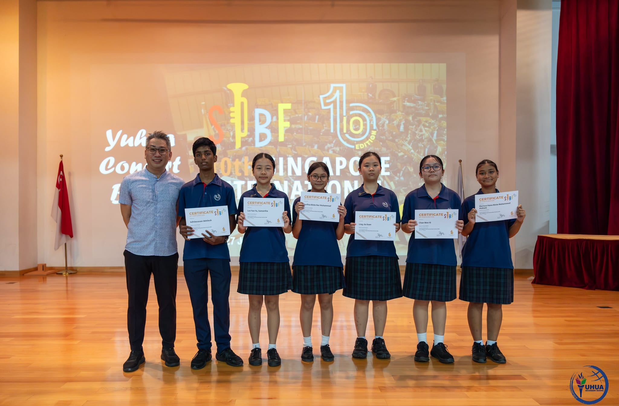 Posing with certificate