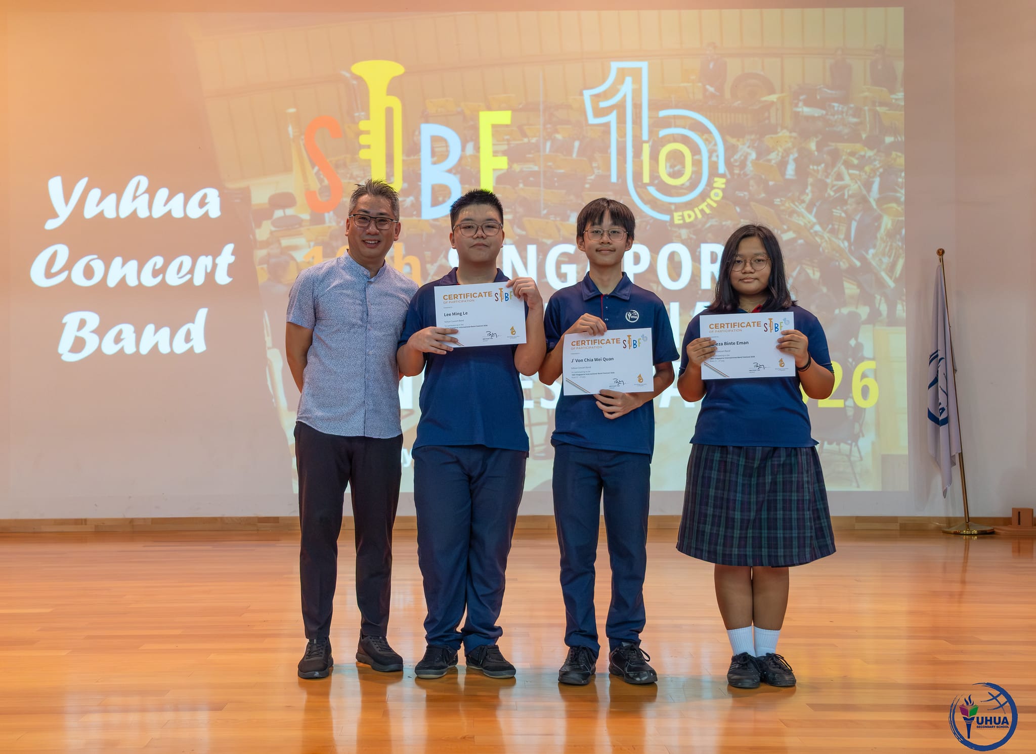 Posing with certificate