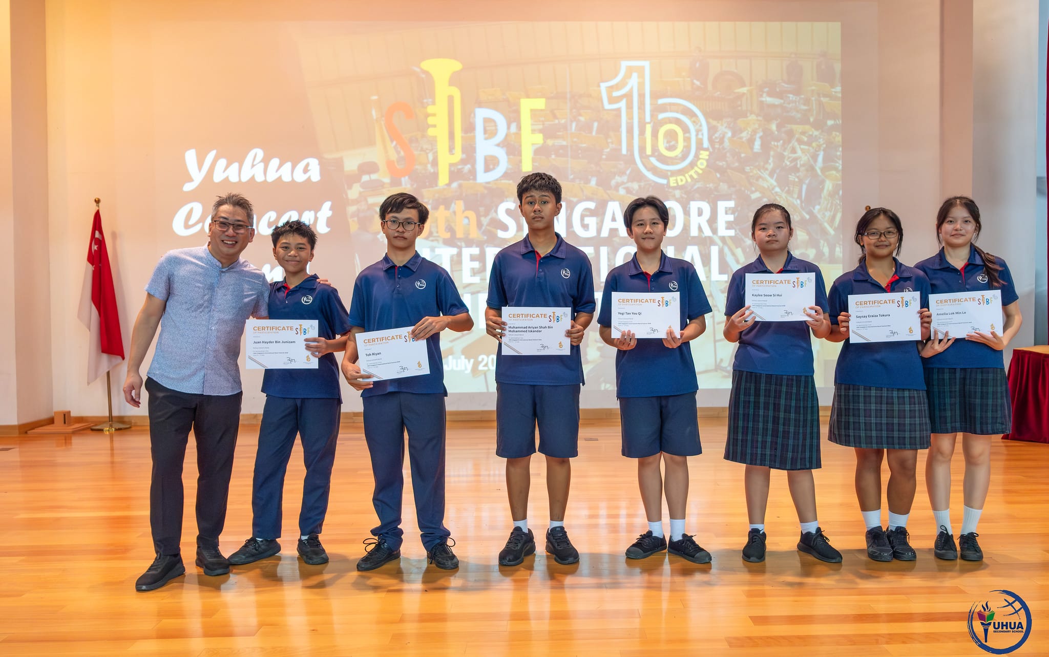 Posing with certificate
