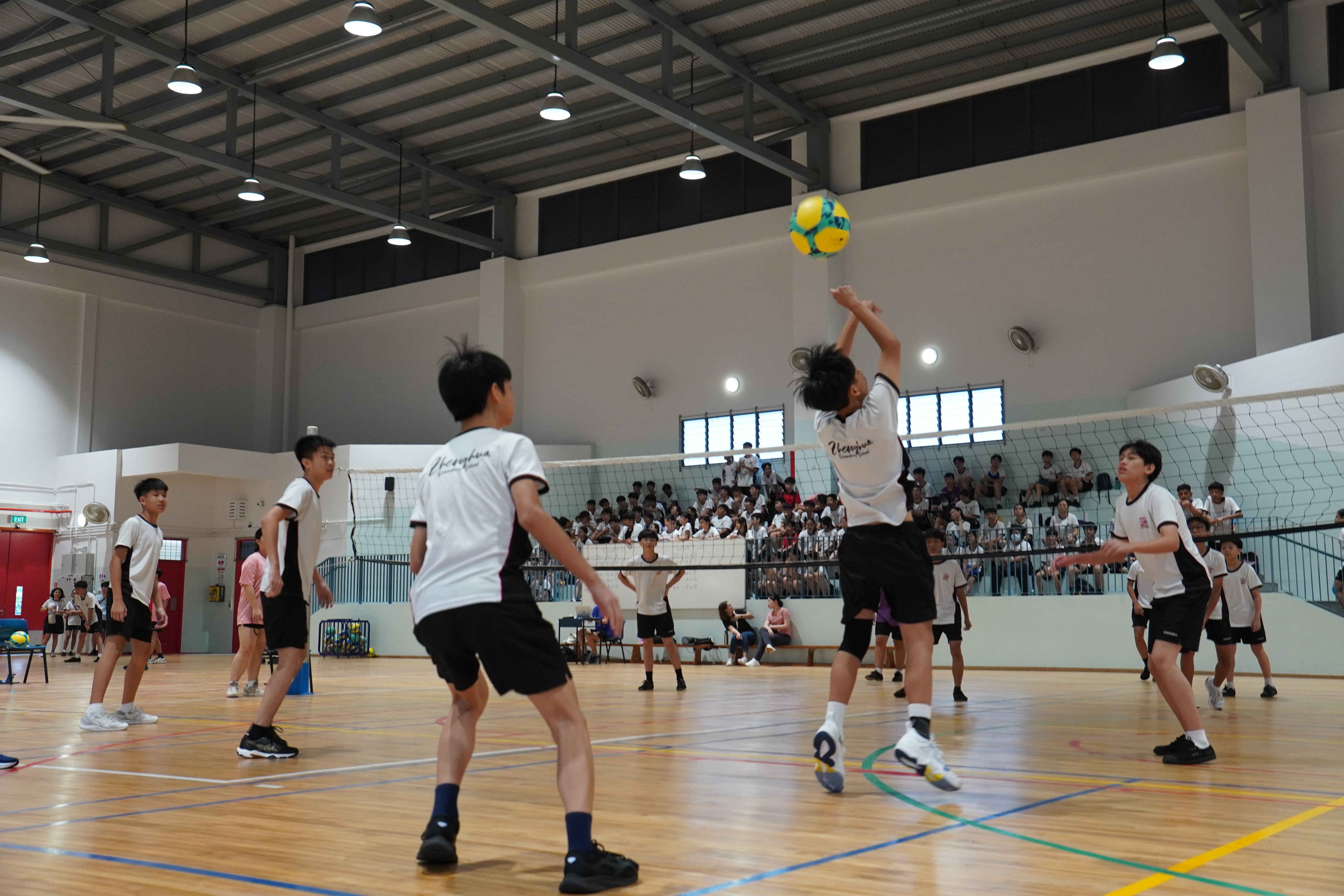 Students playing volleyball
