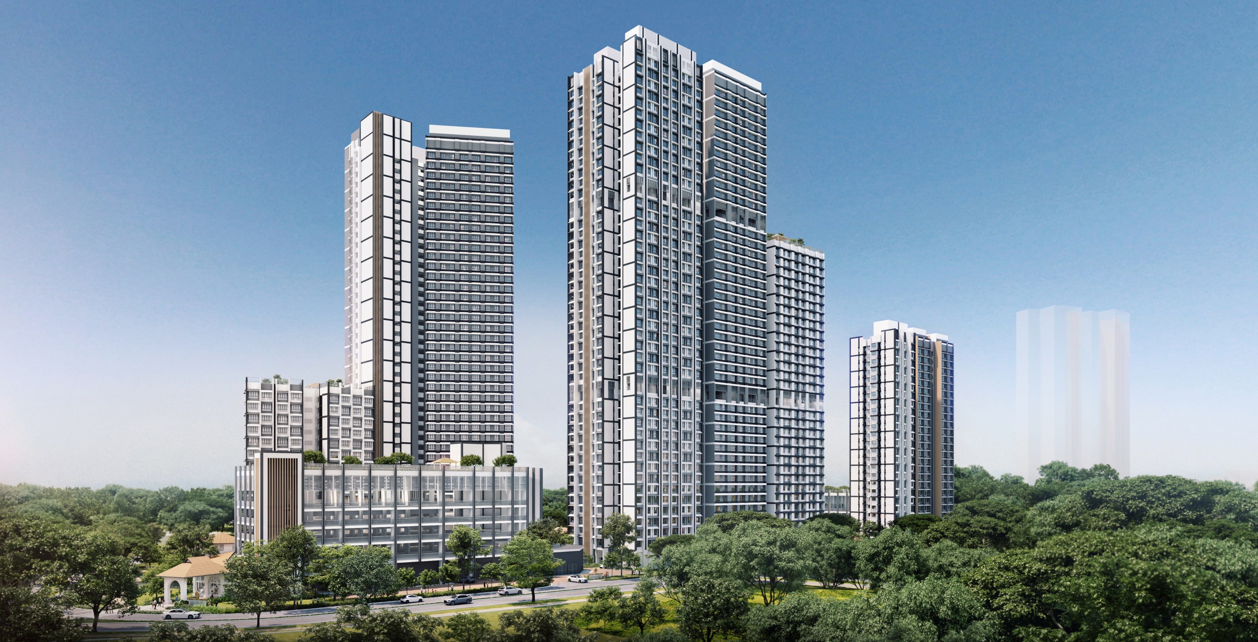 Cluster of modern high-rise towers with glass facades above trees, under a clear blue sky.