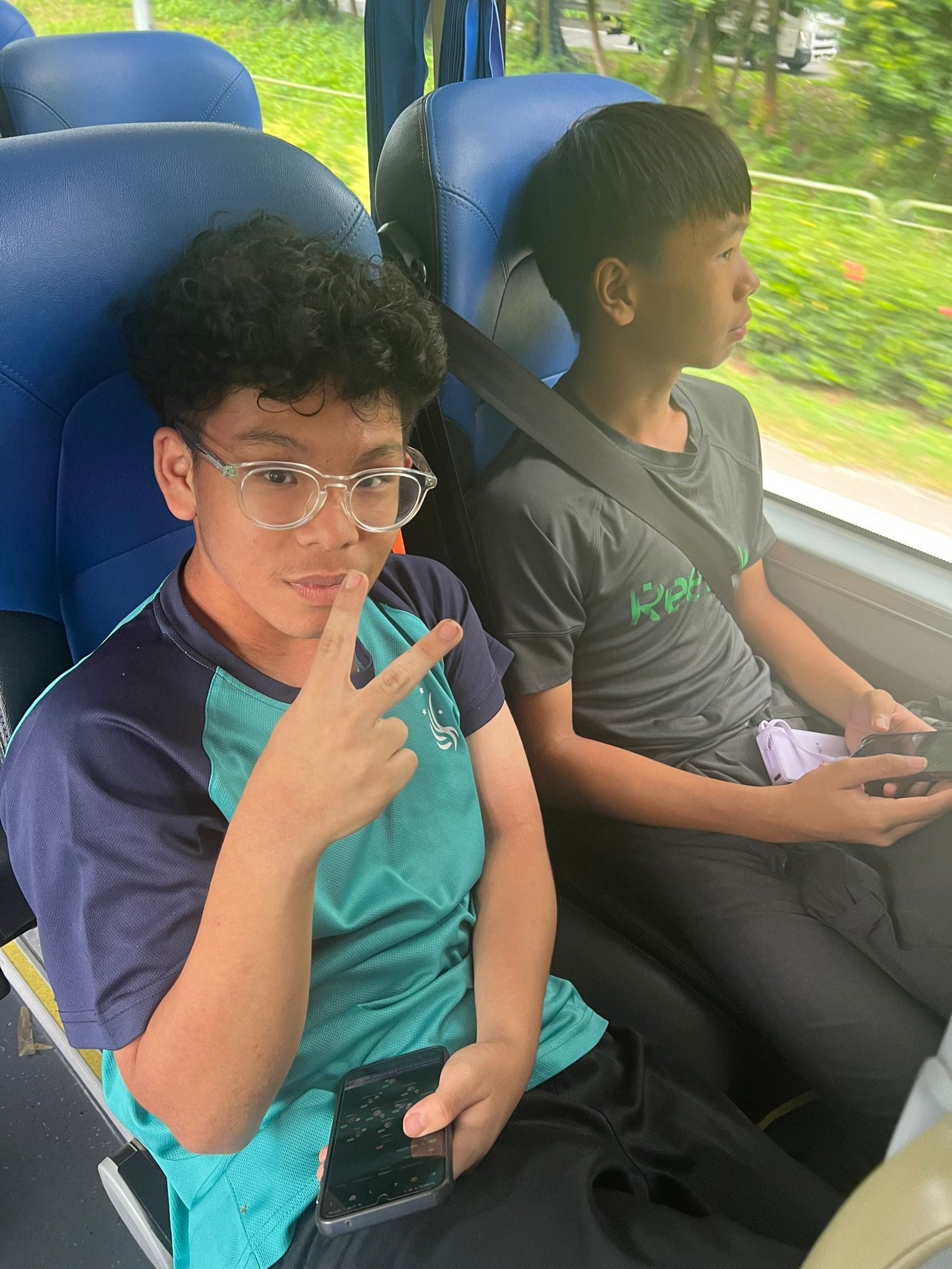 students posing for a photo in a bus