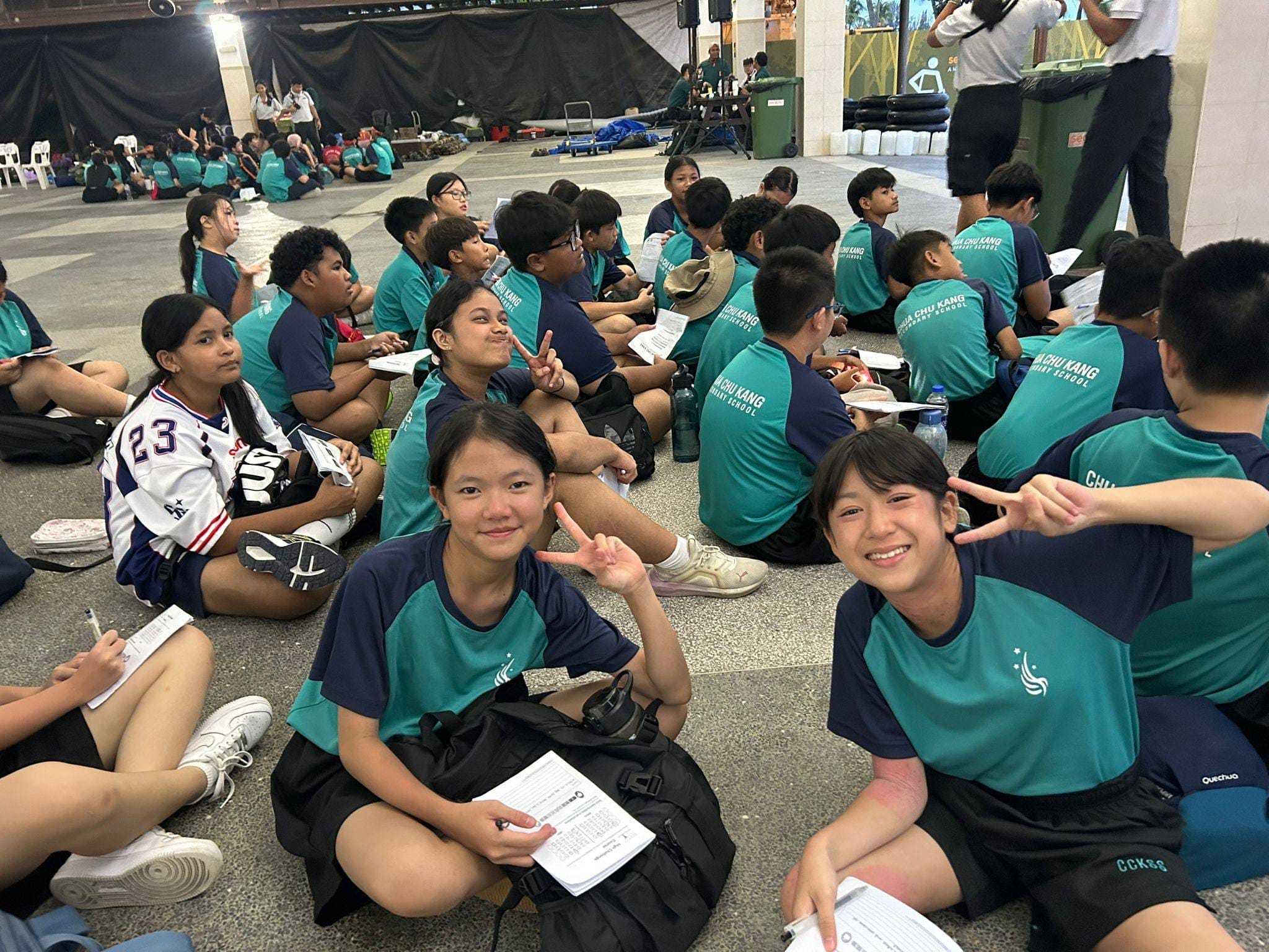 A group of students smiling while at camp