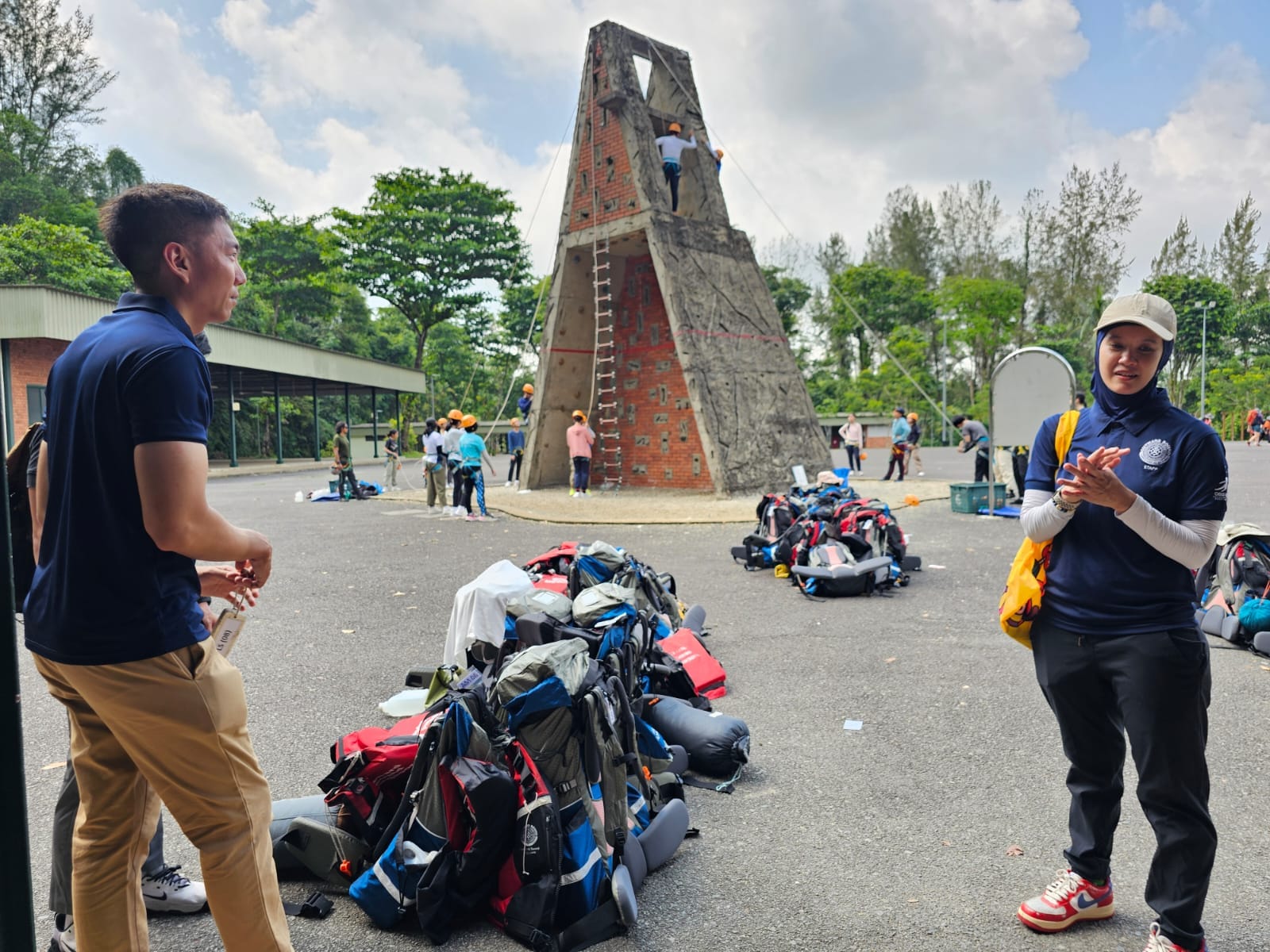 Instructors standing near backpacks