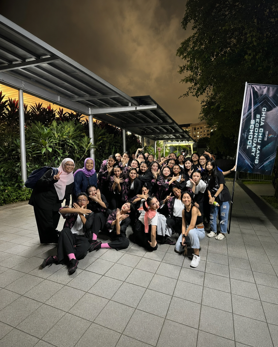 Modern dancers posing after Super24 with teachers and vice principal