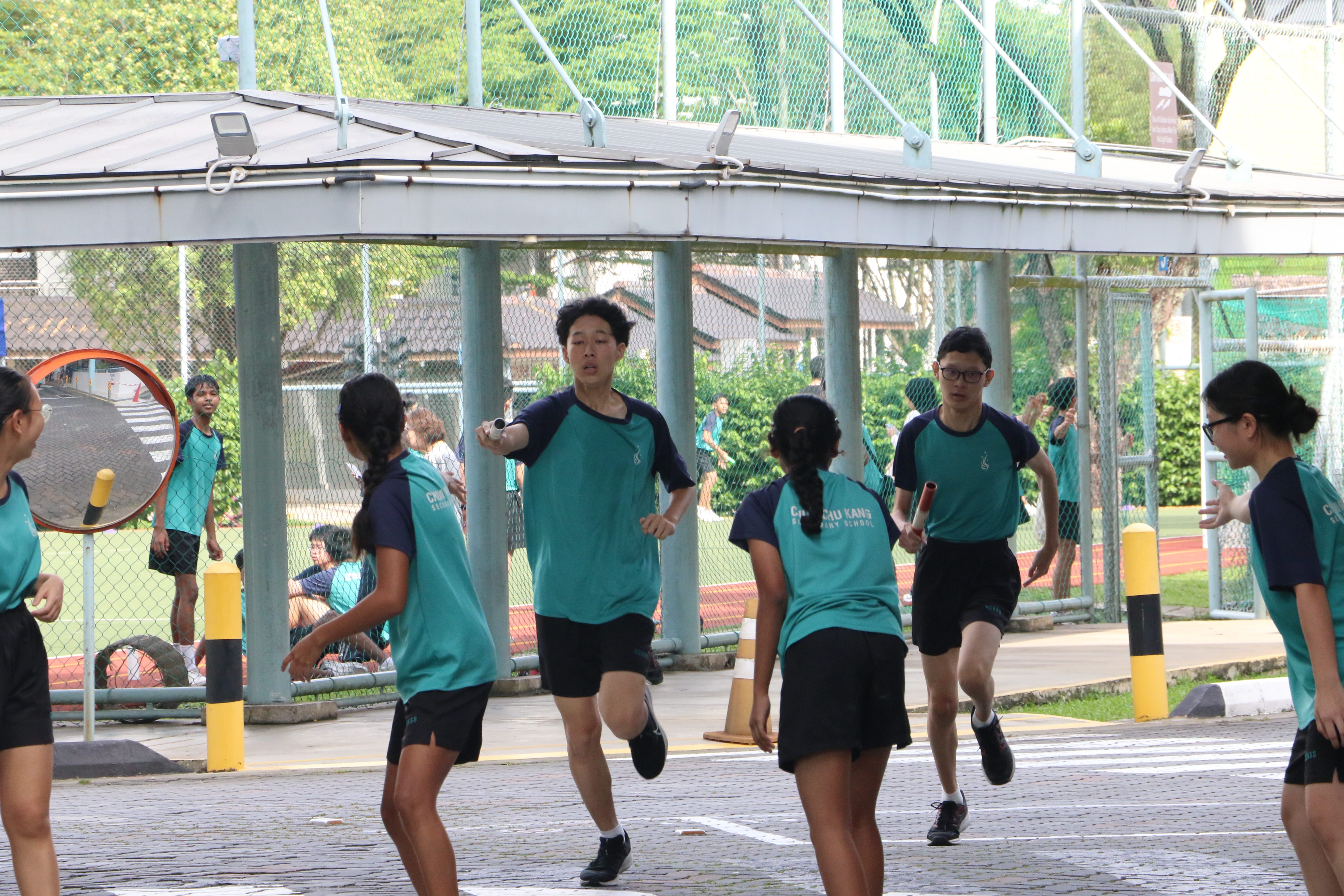 students run a relay race