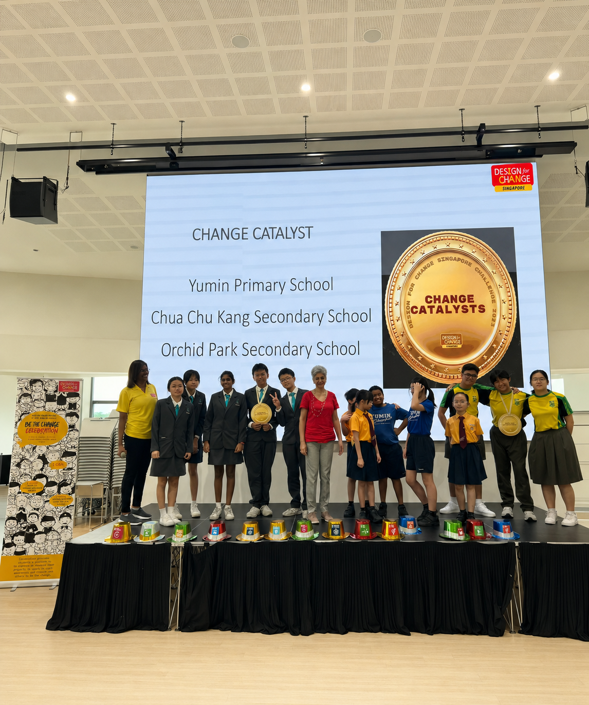 students on stage receiving an award