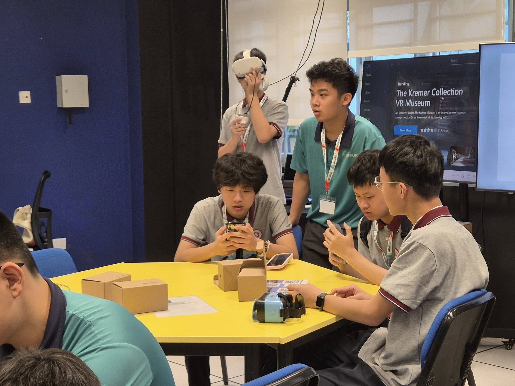 A group of students check out virtual reality programmes and equipment