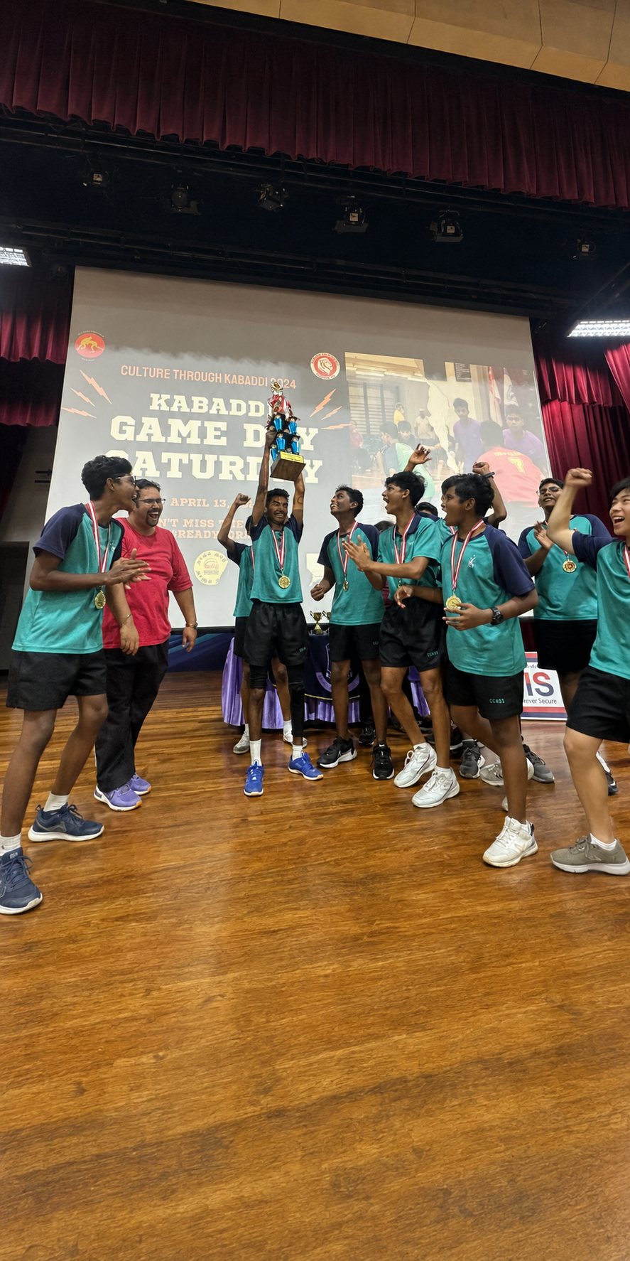 a group of boys holding up a trophy