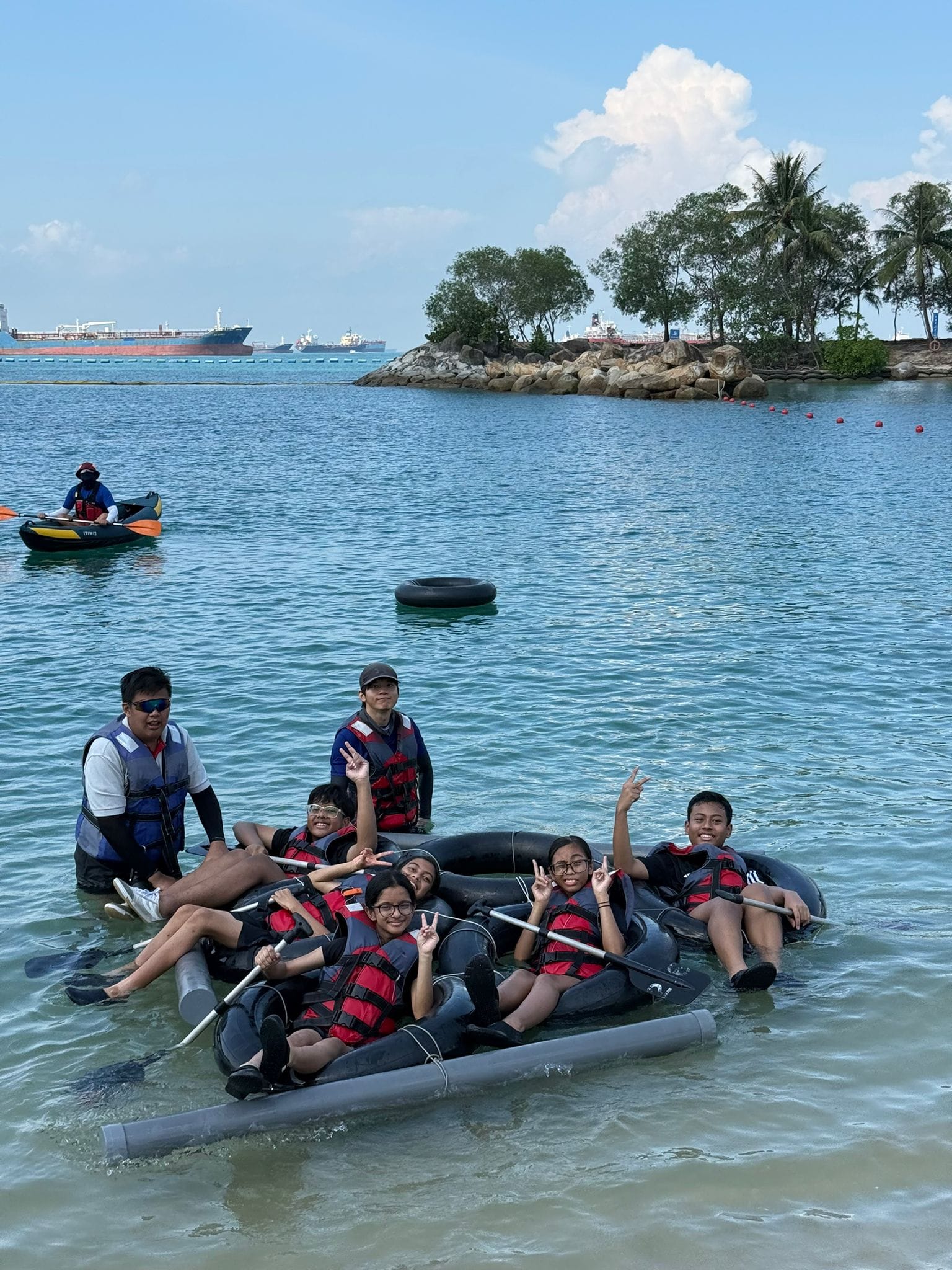Students in a raft in the water