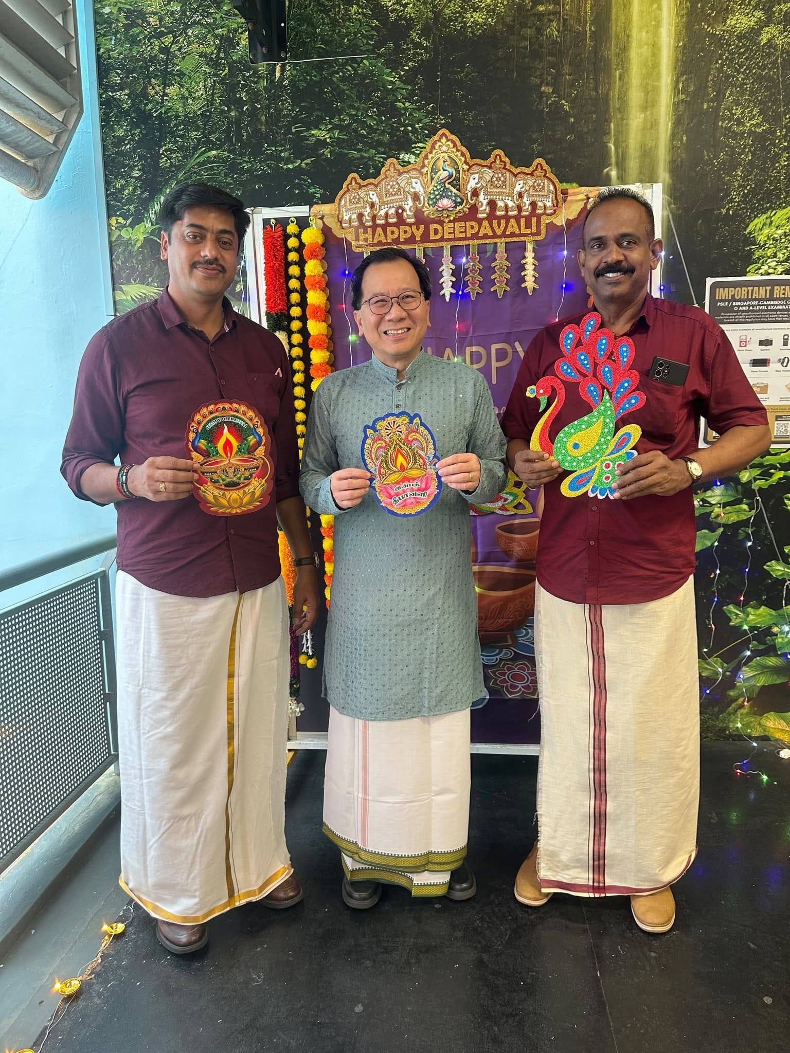 3 men in traditional indian wear stand together